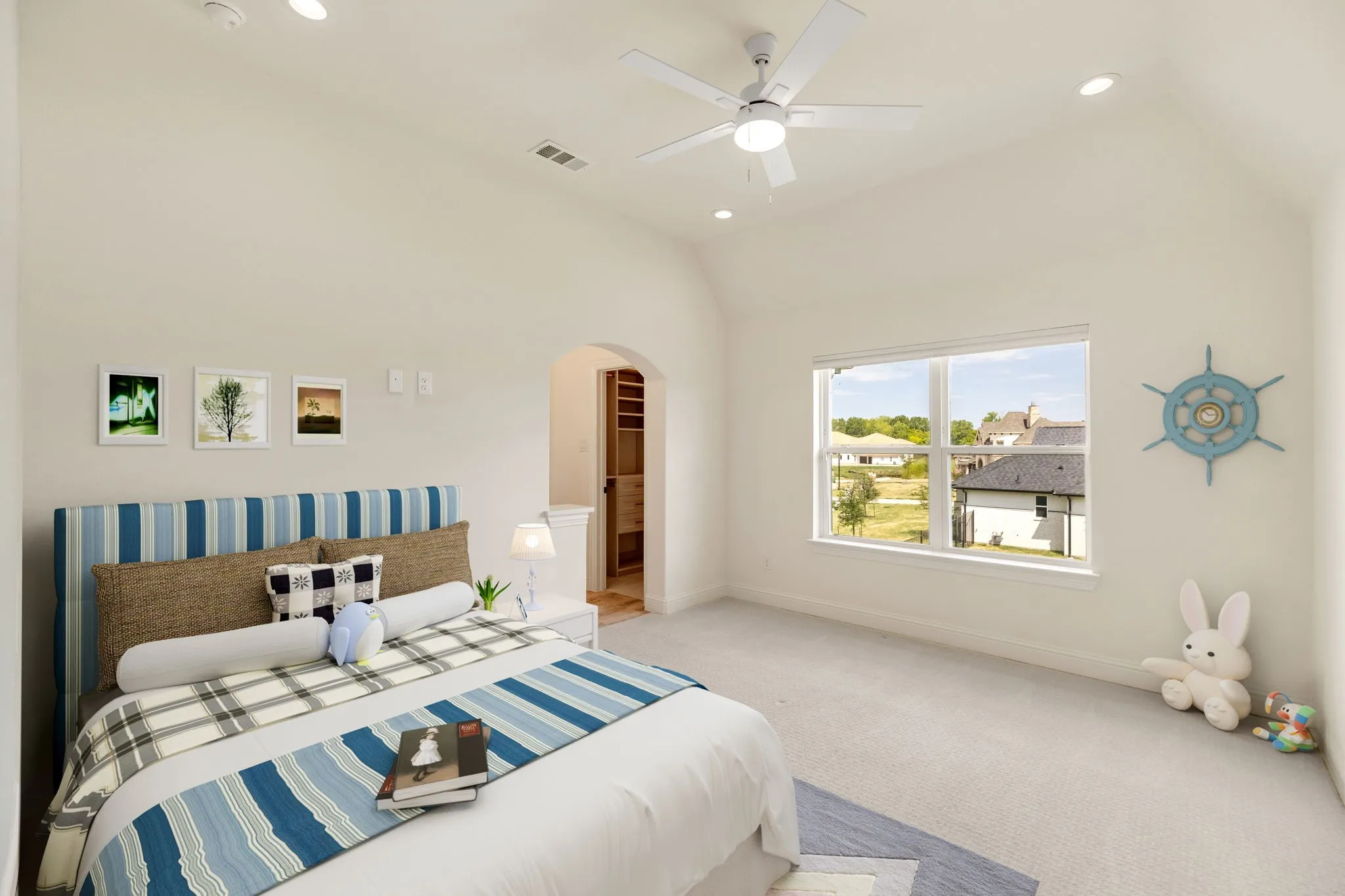 Bedroom virtually staged, Vaulted ceiling with recessed lighting and ceiling fan