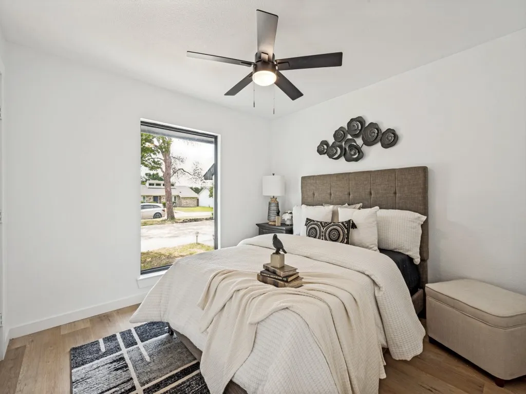 Clean white walls with wood-finish flooring