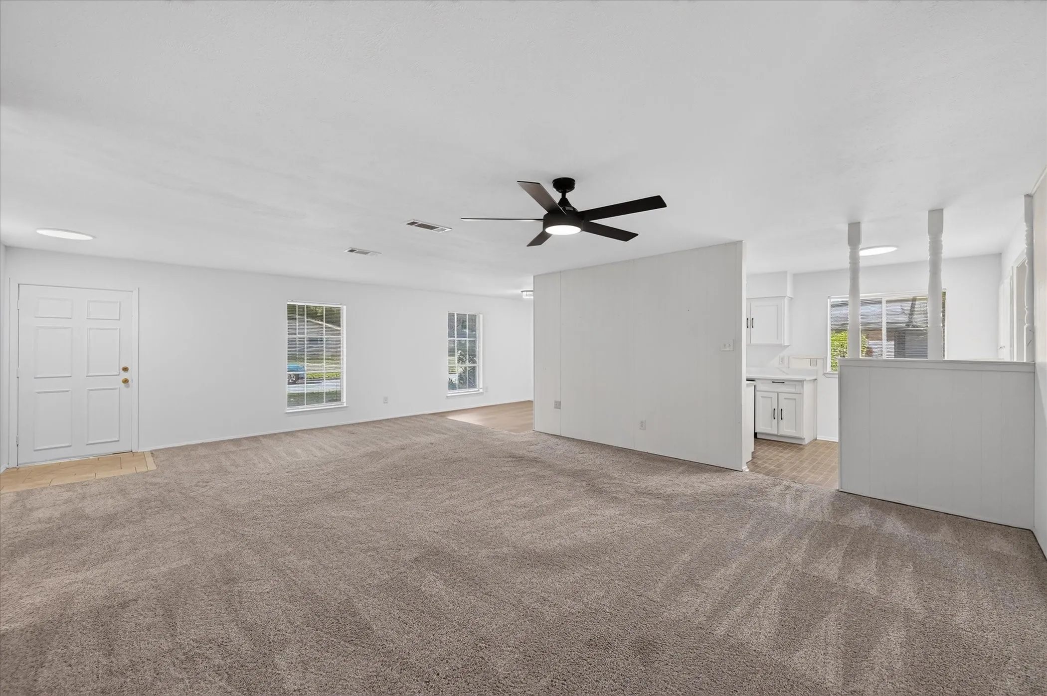 Spacious living room that flows into the kitchen and dining area.