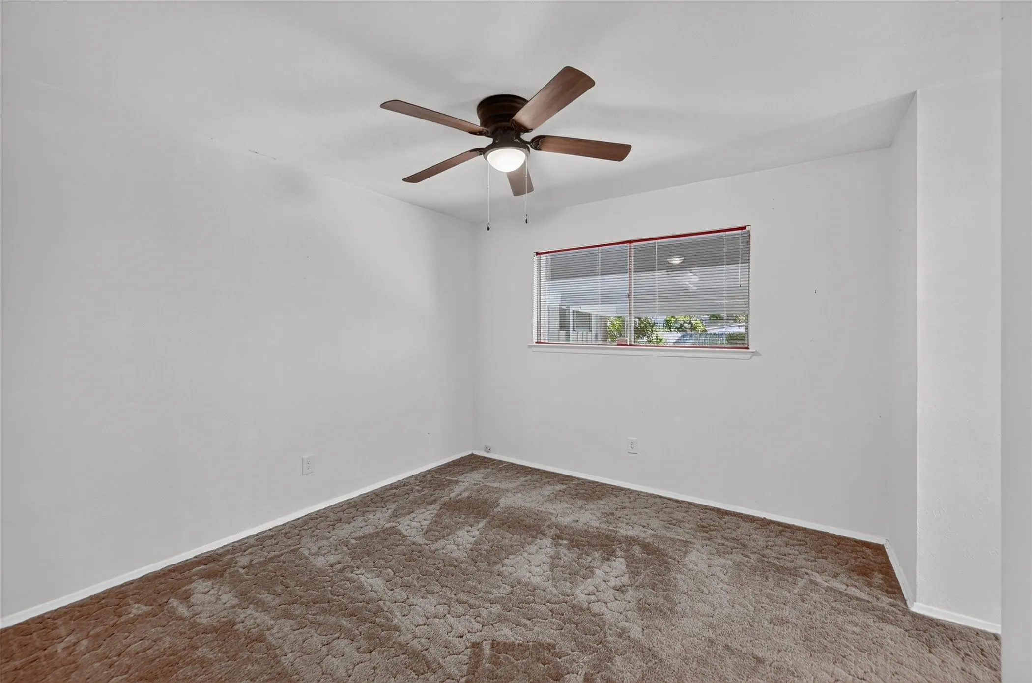Primary bedroom with window to the backyard