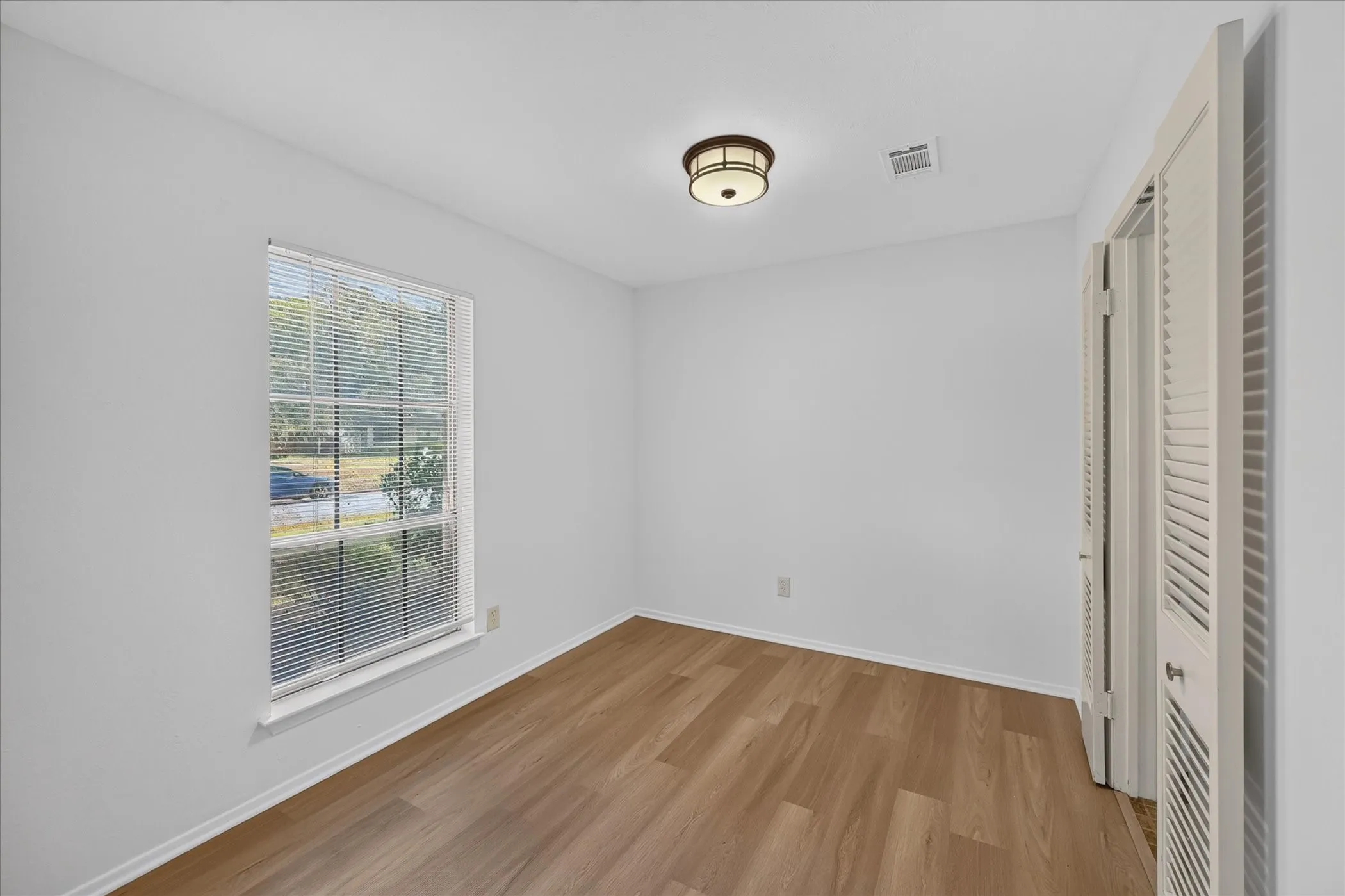 Dining area off the kitchen and living room with view of the front yard