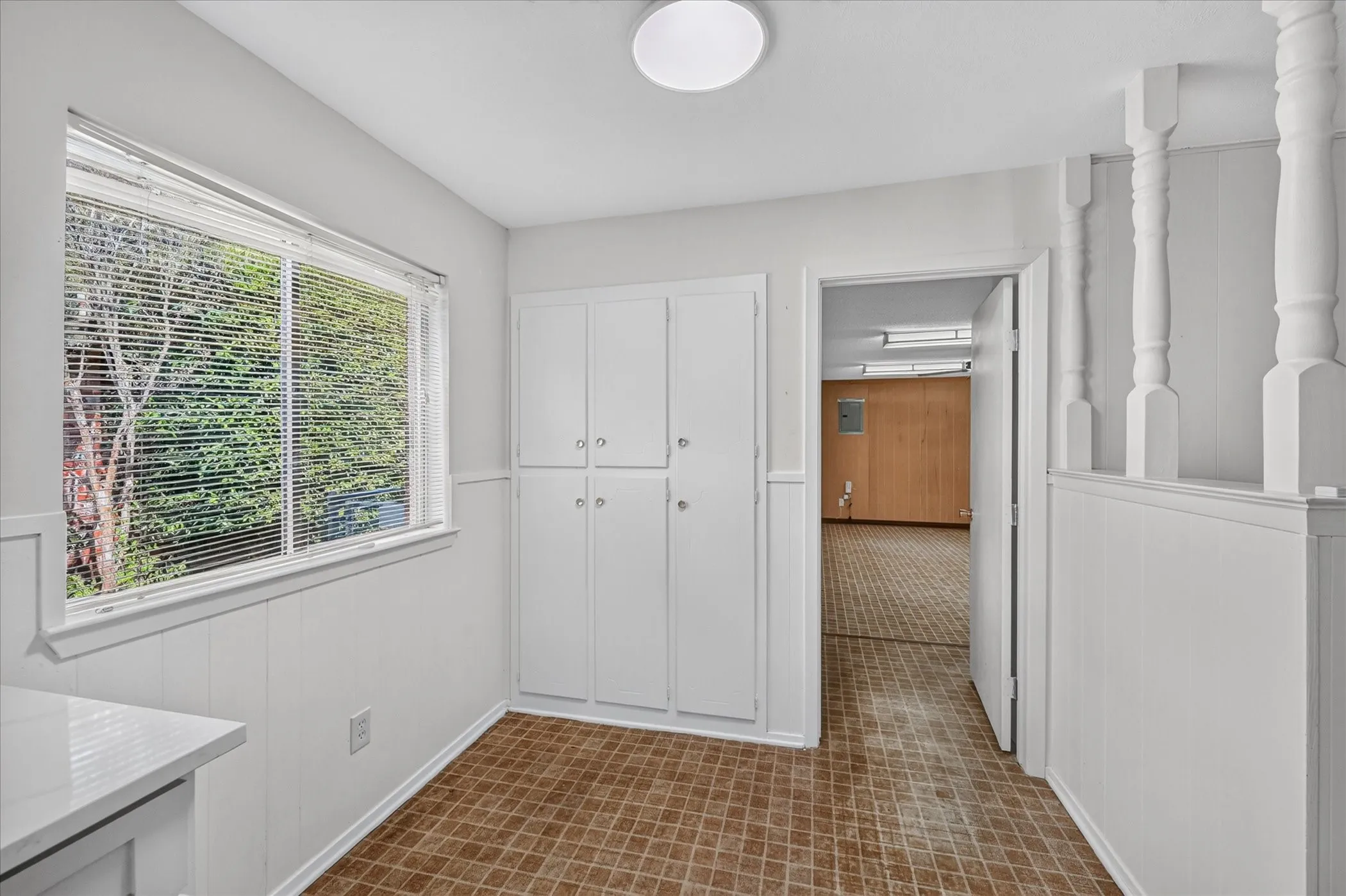End of the kitchen leads to a flexible bonus room with washer and dryer hook ups