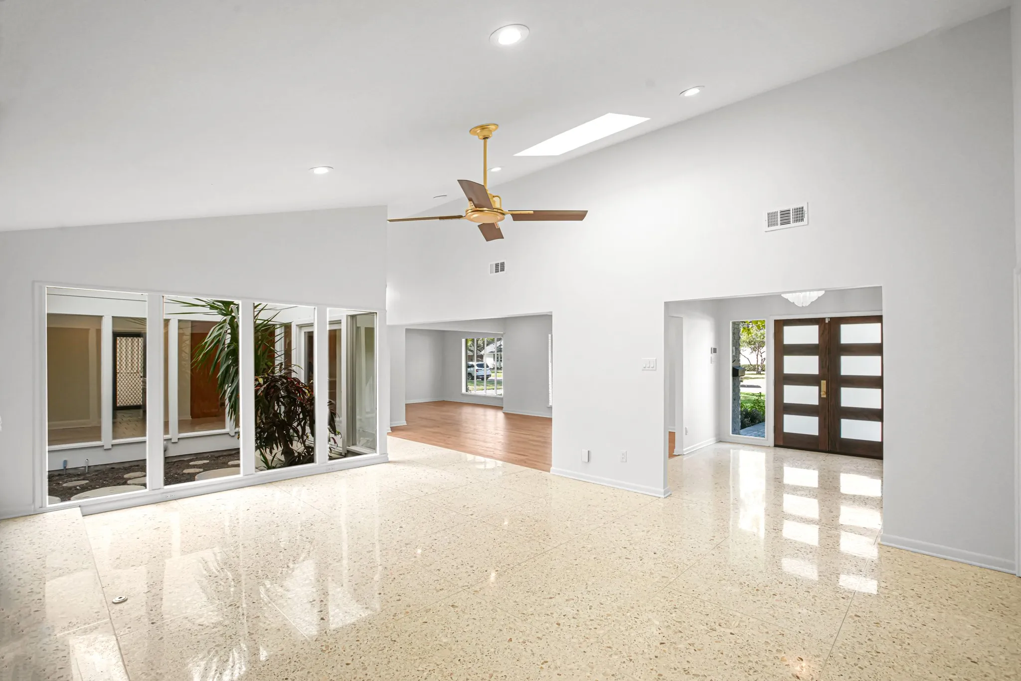 Beautiful view of the Entry, Atrium, and living areas.  The kitchen is located on the other side of the Atrium.  This home was built to take full advantage of every bit of the natural light!
