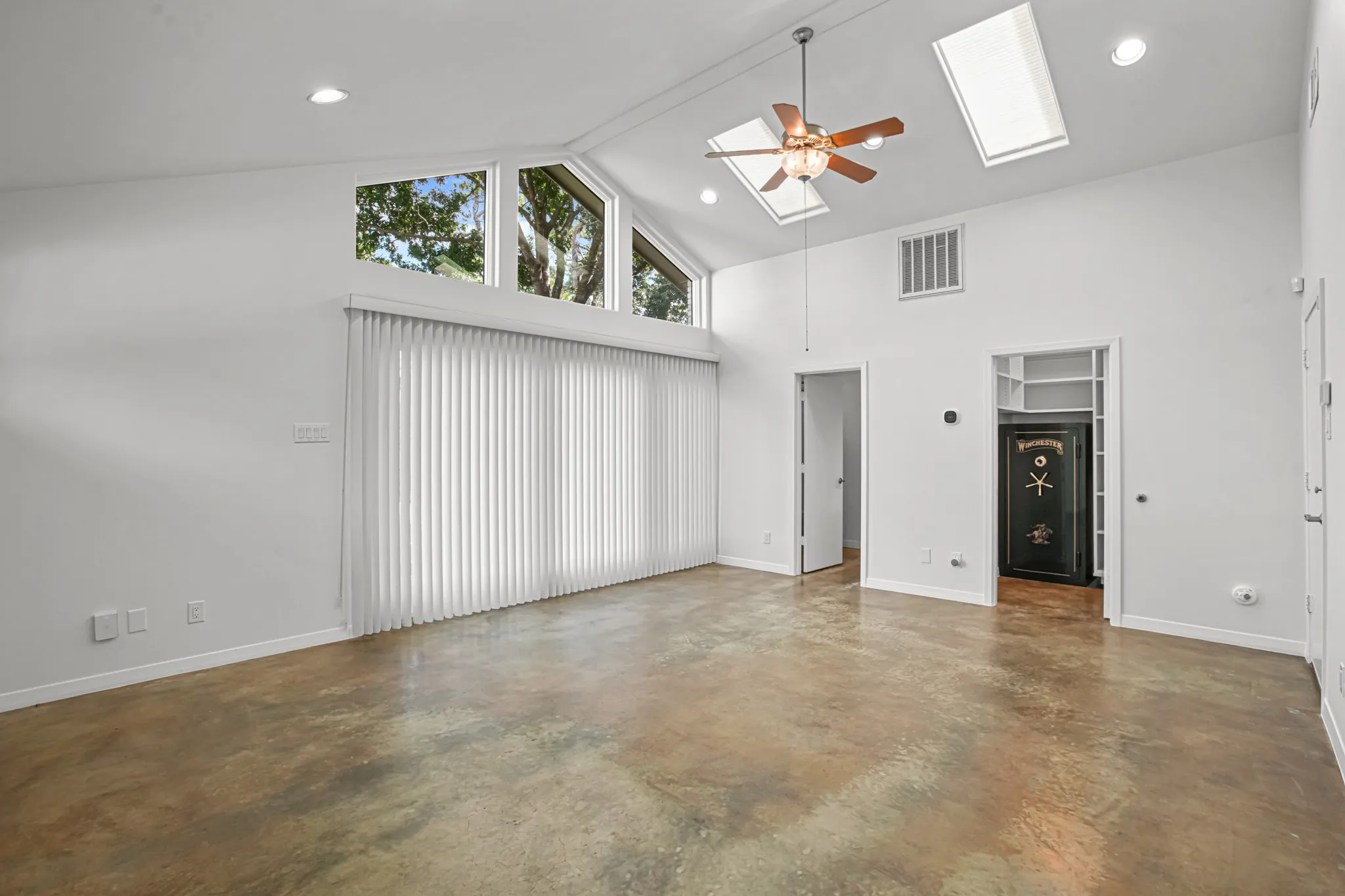 This space is adjacent to the detached garage.  It would be perfect for a multi-generational family, a teen-ager, guest quarters, an office, exercise room - whatever fits your needs.  The gun safe remains and there is a generator that will also remain for this space.