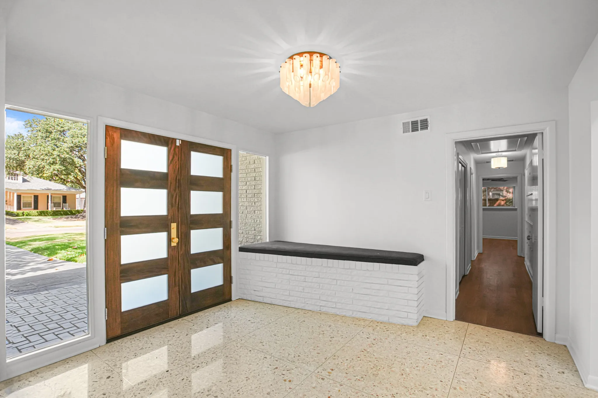 Beautiful and inviting entry - much of the original mid-century modern character has been lovingly preserved.  The original terrazzo floors are stunning!