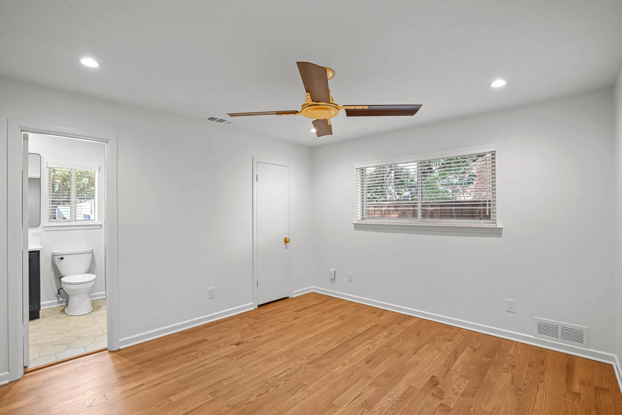 Alternate view of Bedroom 3 with private entrance to Jack-n-Jill bathroom, walk-in closet, and gorgeous hardwoods!