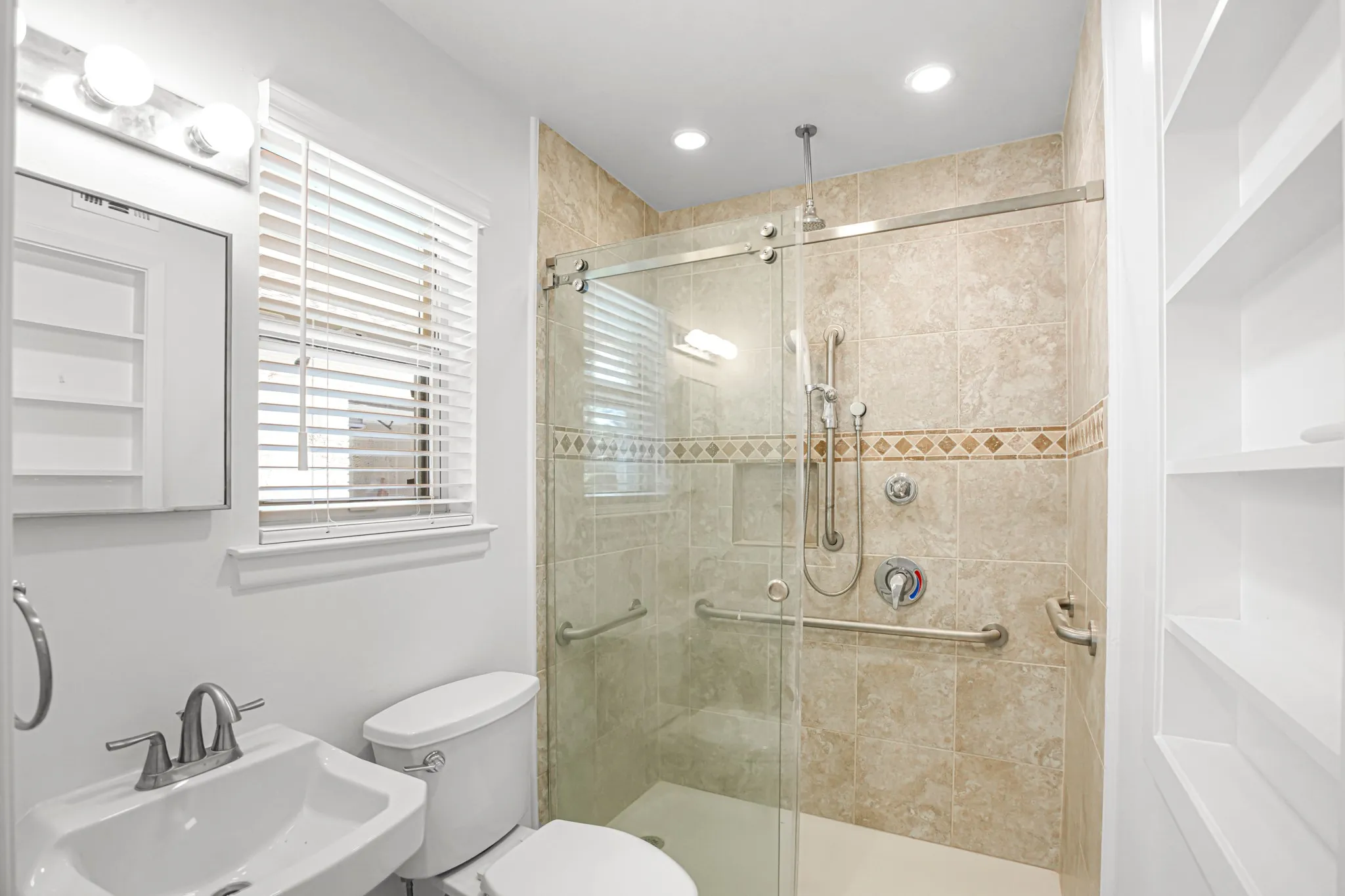 Bedroom Four has a private, handicap accessible bathroom with safety bars and a curb-less entry to the shower.