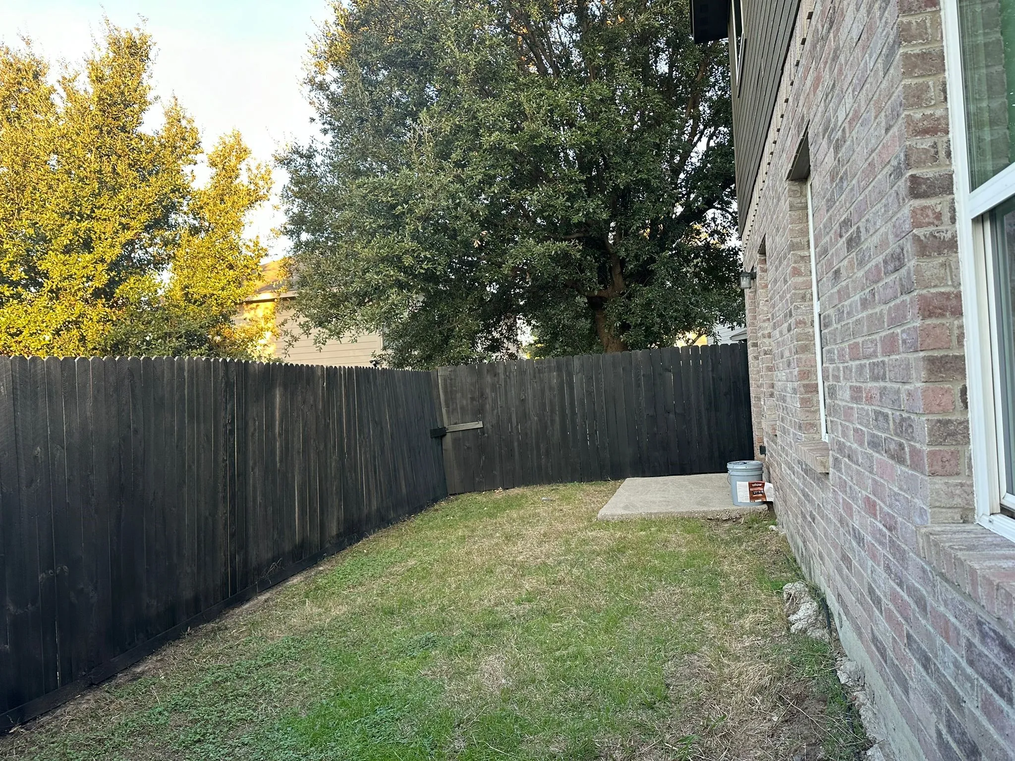 Exterior brick facade with white trim windows