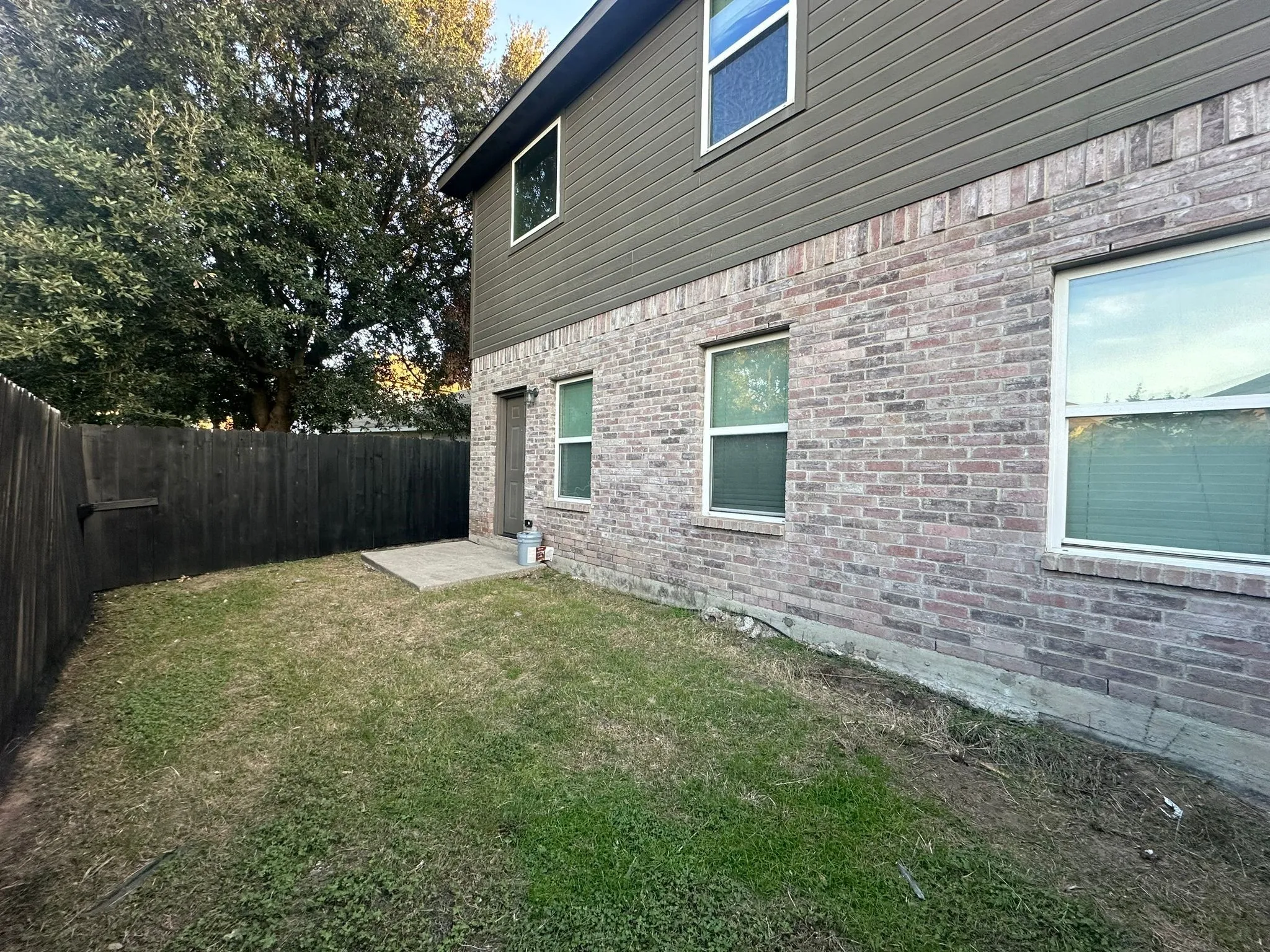 Brick and siding exterior with multiple windows