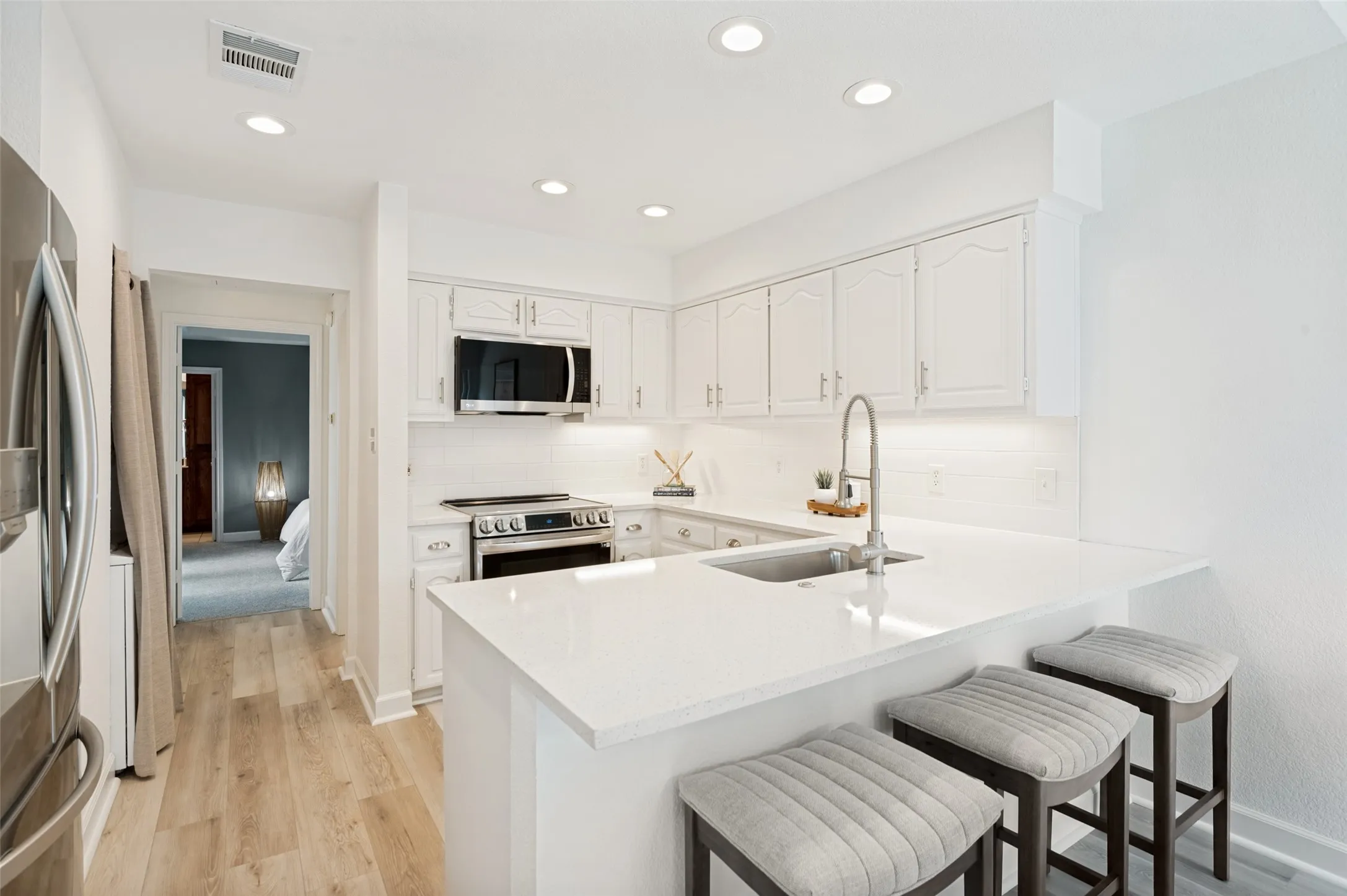 This beautifully updated kitchen blends timeless elegance with modern functionality.