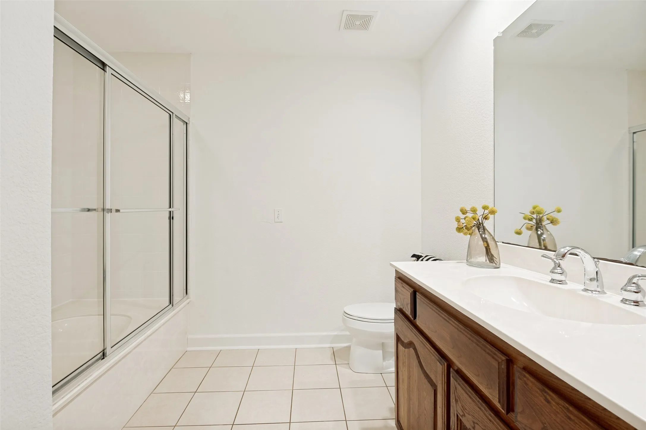 The combination tub and shower provides flexibility for a relaxing soak or a quick refresh, while neutral finishes create a timeless backdrop ready for any style.