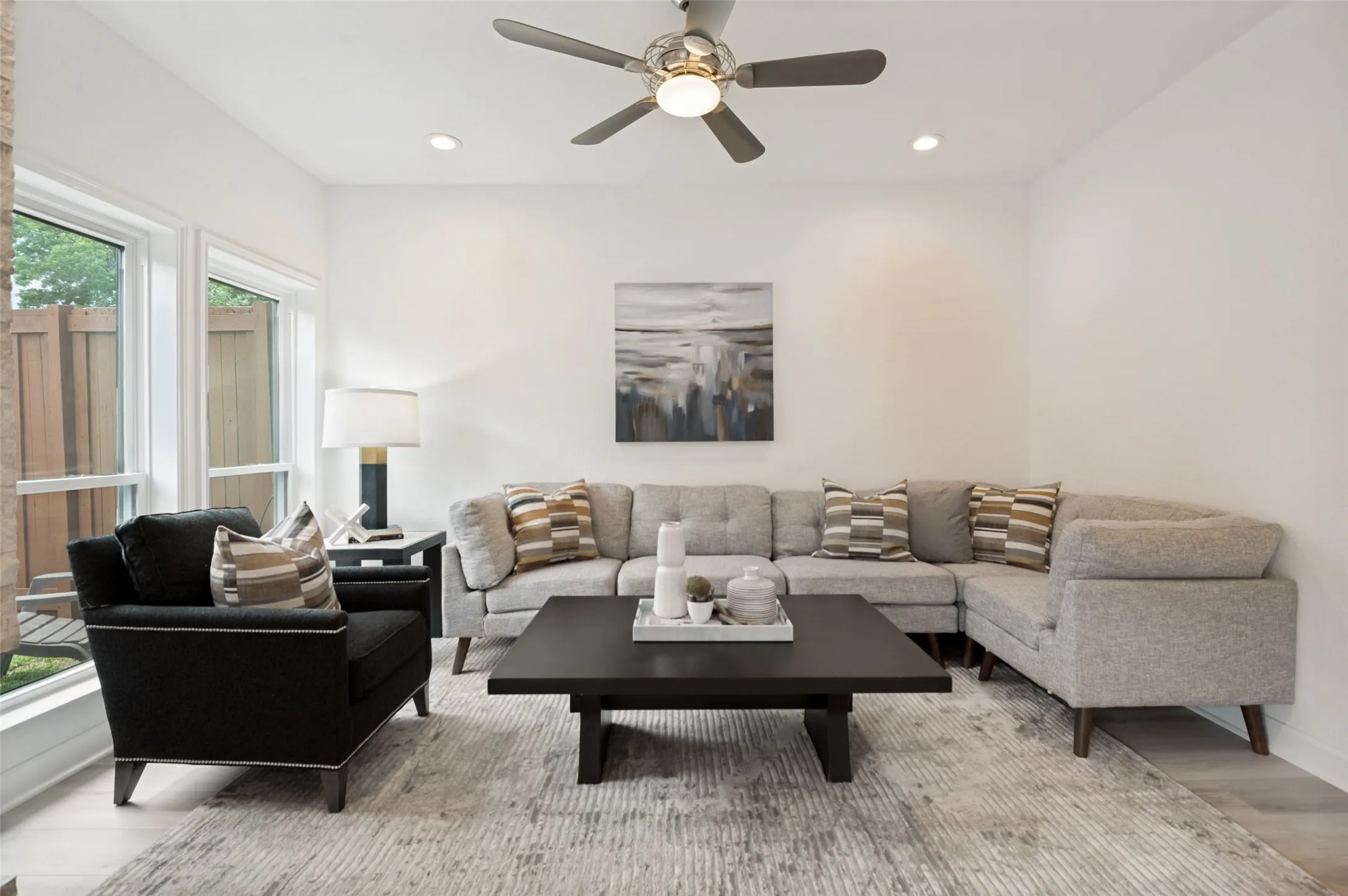 Brand-new energy-efficient windows flood the room with natural light while enhancing comfort and energy savings year-round. The open layout flows seamlessly into the adjacent living spaces, making it ideal for entertaining or relaxing with family.