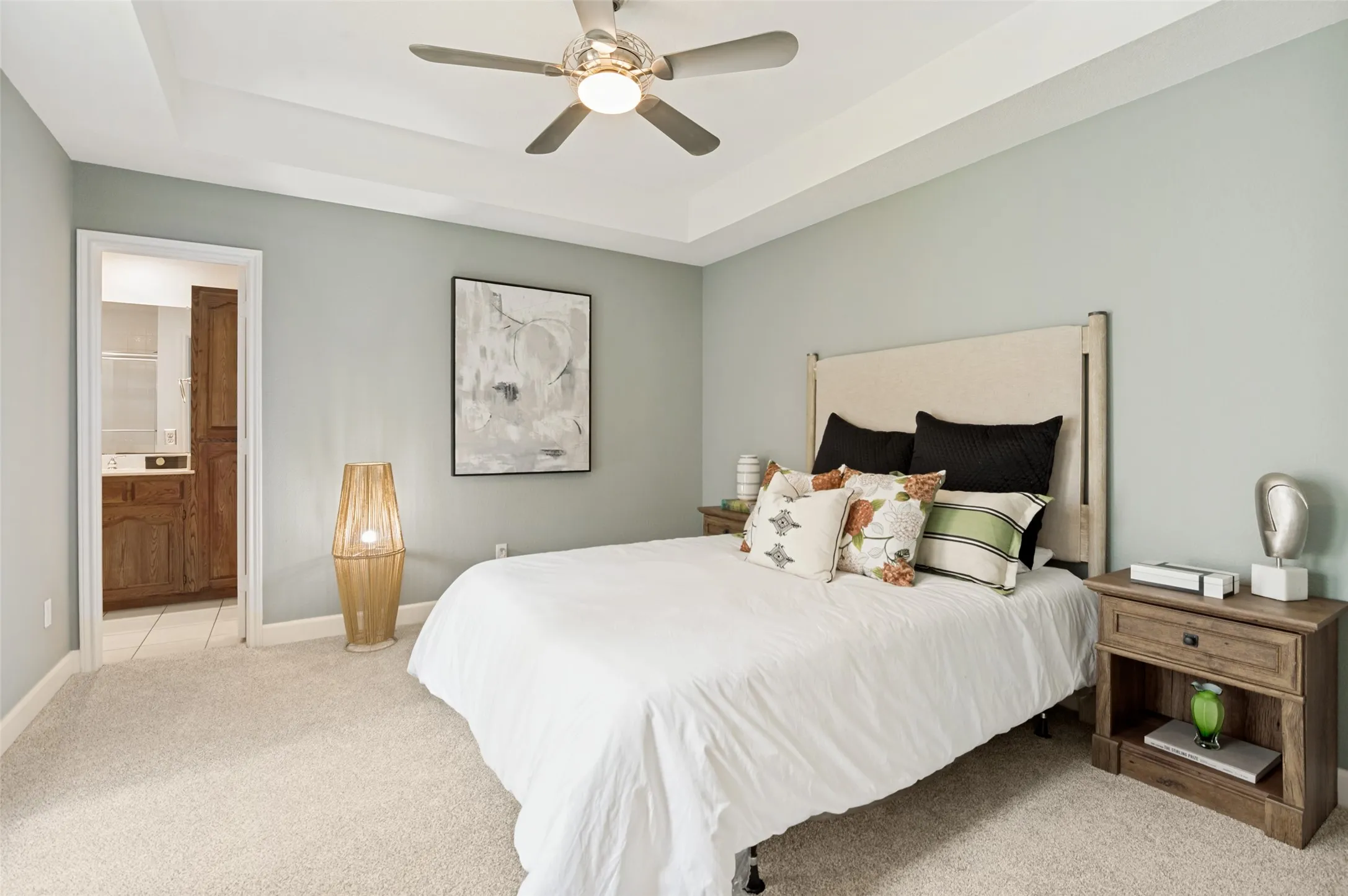 Retreat to the comfort of this spacious primary suite, thoughtfully designed to be a private sanctuary. Generous proportions provide ample space for a sitting area or additional furnishings, and the large layout is complemented by an ensuite bath for ultimate convenience and privacy.