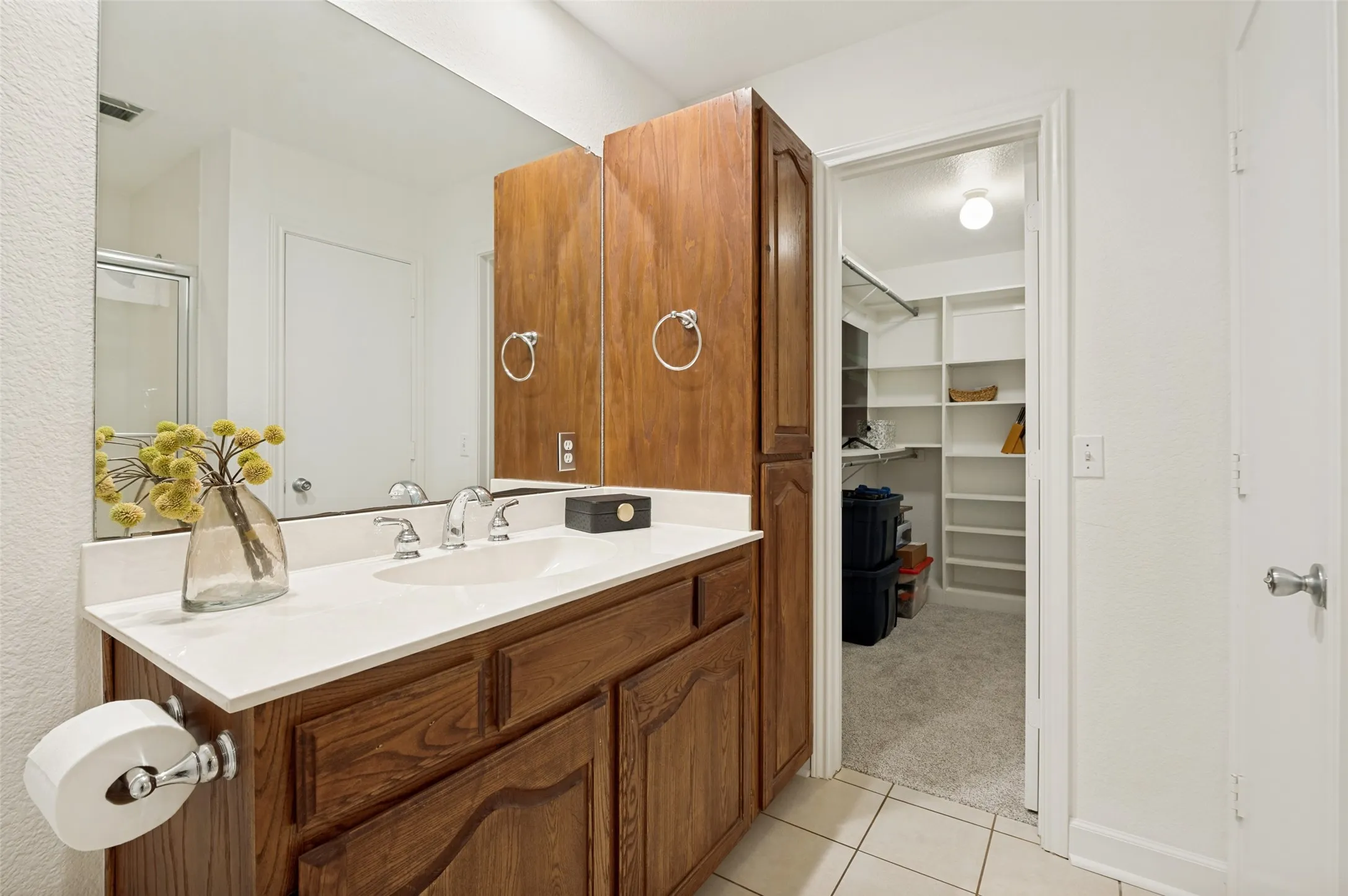 Conveniently connected to the primary suite, this private bath delivers comfort, practicality, and everyday convenience.