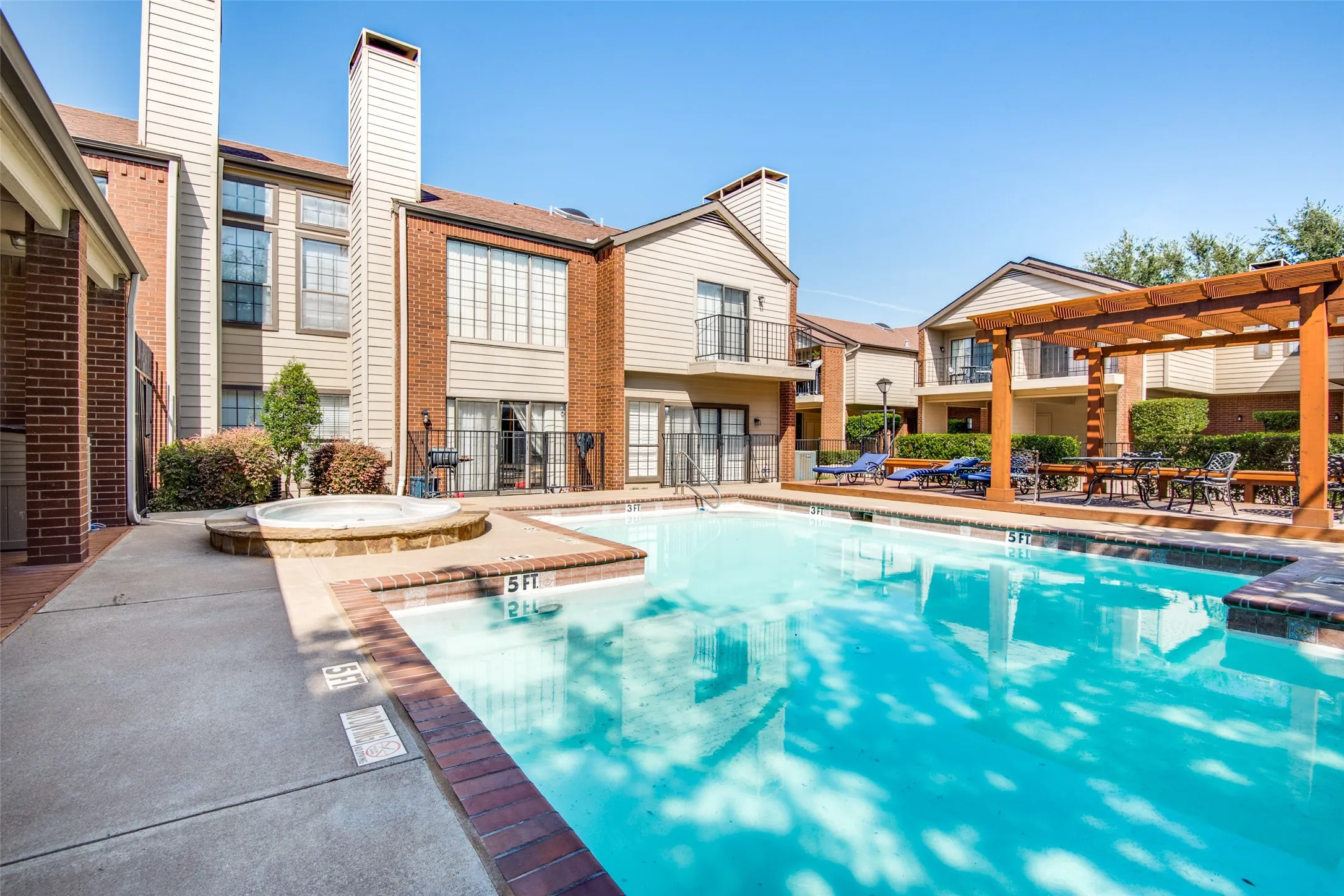 Resort-style amenities await just steps from your front door. This beautifully maintained community pool and spa provide the perfect setting to relax, unwind, and enjoy the Texas sunshine. Lounge poolside with friends, take a refreshing swim on warm afternoons, or soak in the spa after a long day. The inviting pergola-covered seating area offers a shaded retreat for gathering and socializing, while the professionally landscaped surroundings create a peaceful, vacation-like atmosphere.