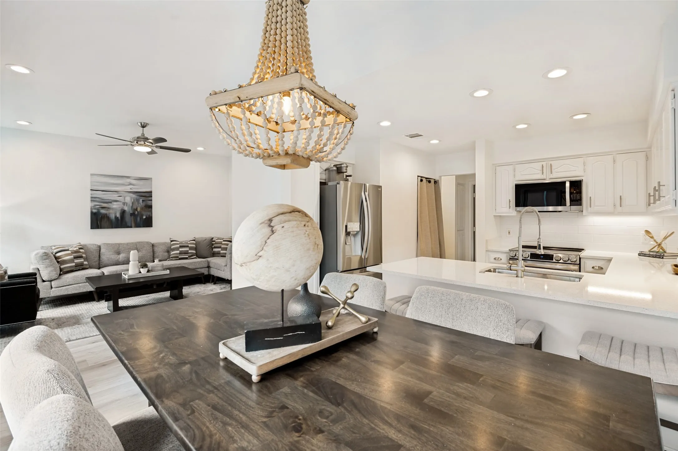 The open-concept design creates a bright and welcoming atmosphere, seamlessly connecting the kitchen, dining, and living areas into one cohesive space. Whether hosting friends, gathering with family, or enjoying a quiet evening at home, this thoughtfully designed floor plan offers the perfect balance of comfort, functionality, and modern style.
