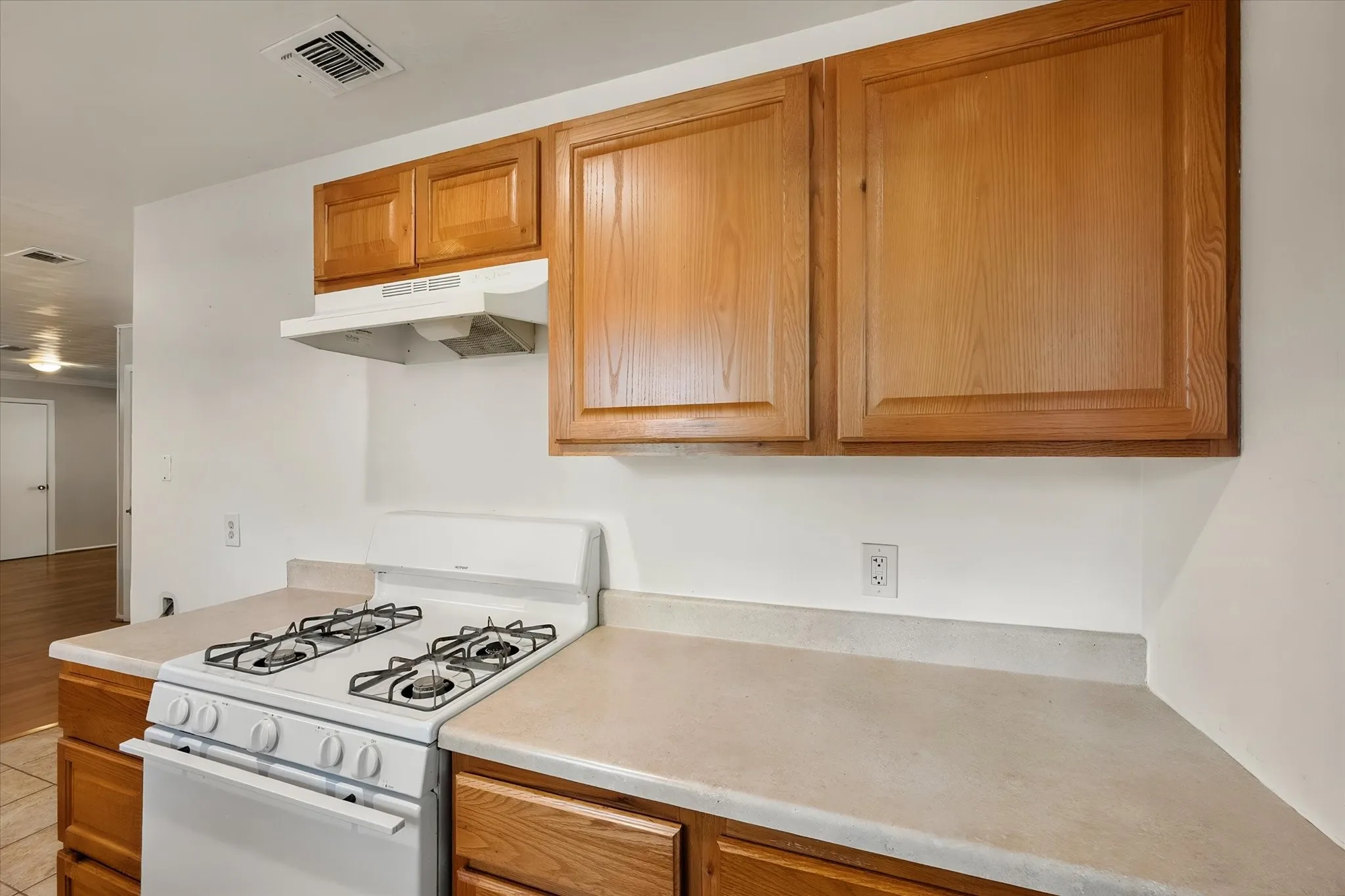 White gas range with a matching range hood