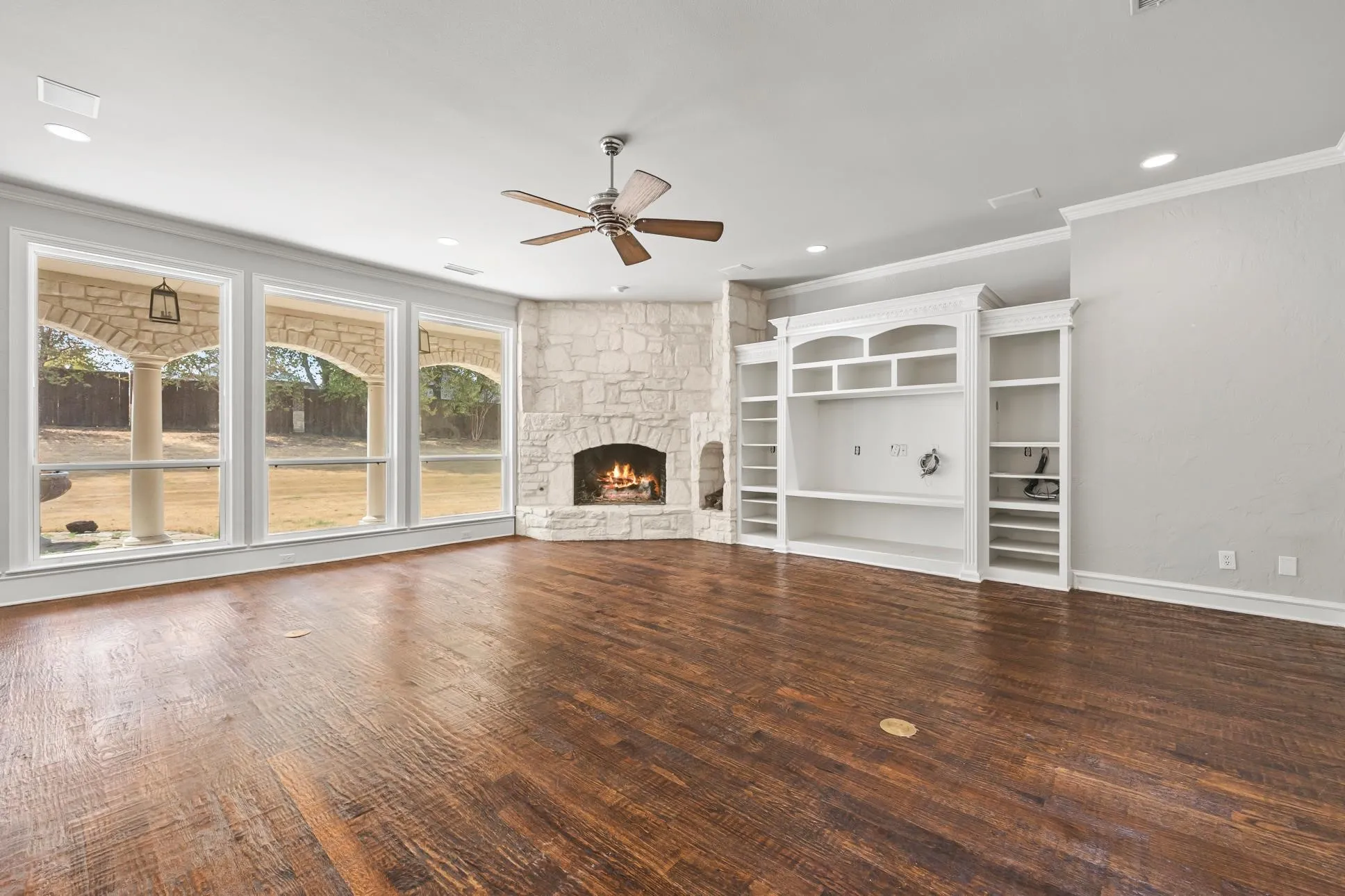 Family room with built-ins and stone fireplace