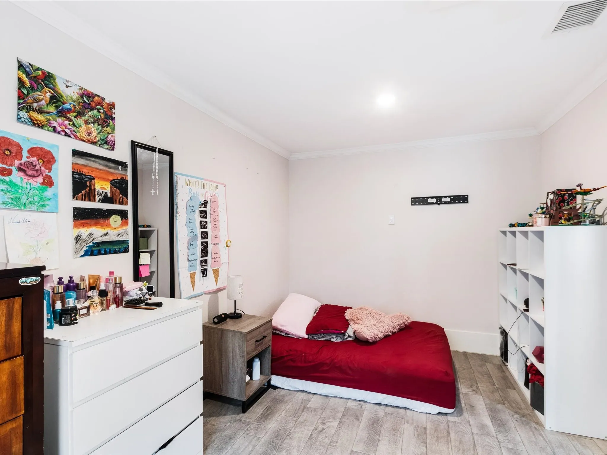 Recessed lighting, crown molding, wood-finish flooring, and white baseboards