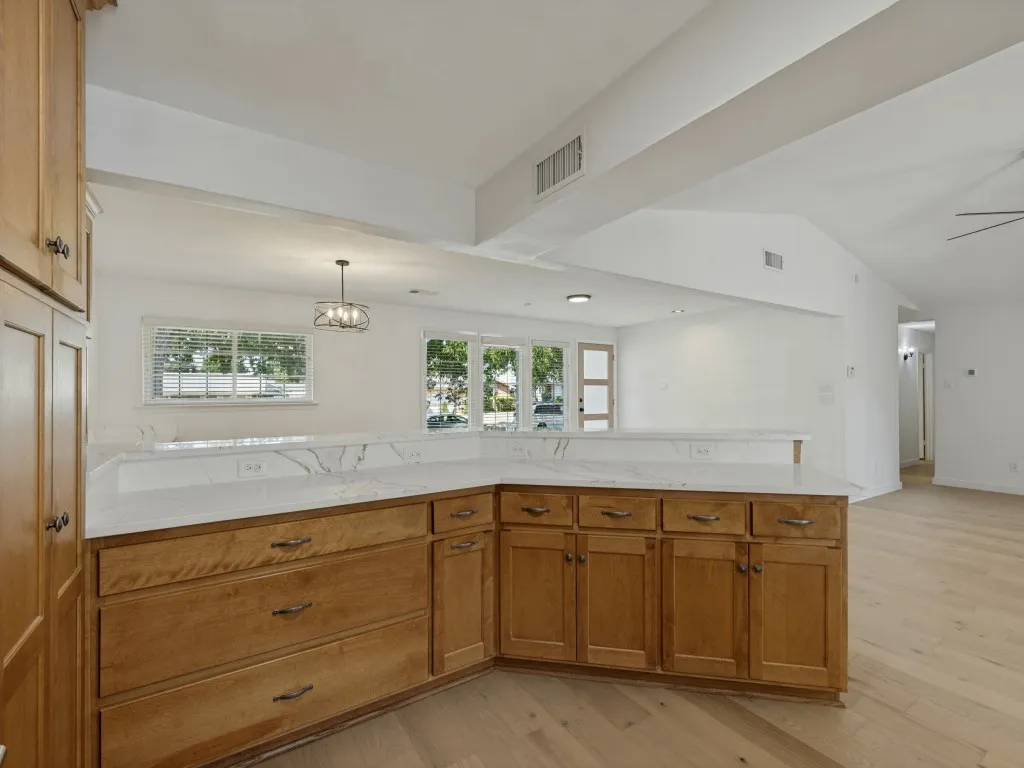 Custom wood cabinetry with dark hardware