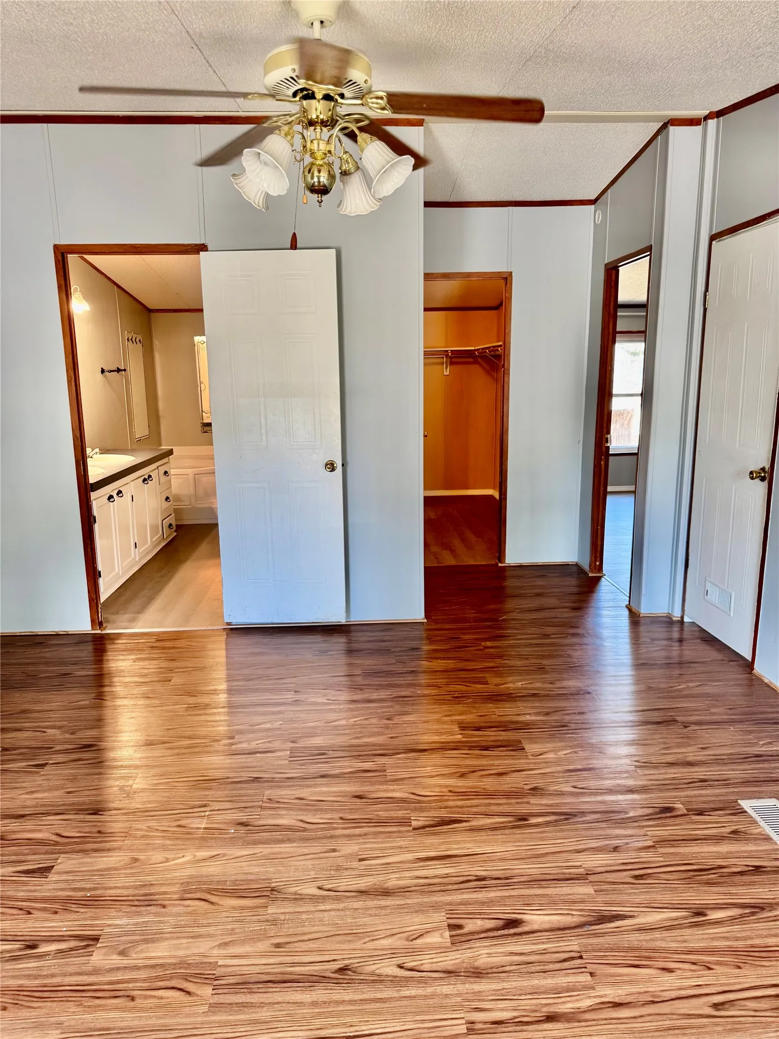 Wood-finish flooring with a ceiling fan with integrated lighting
