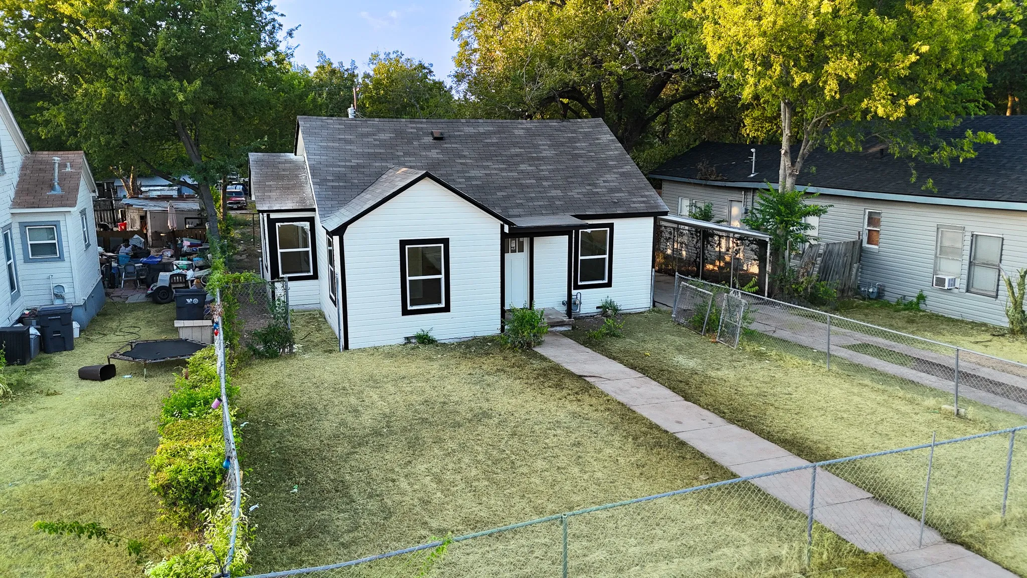 White exterior siding with black trim windows