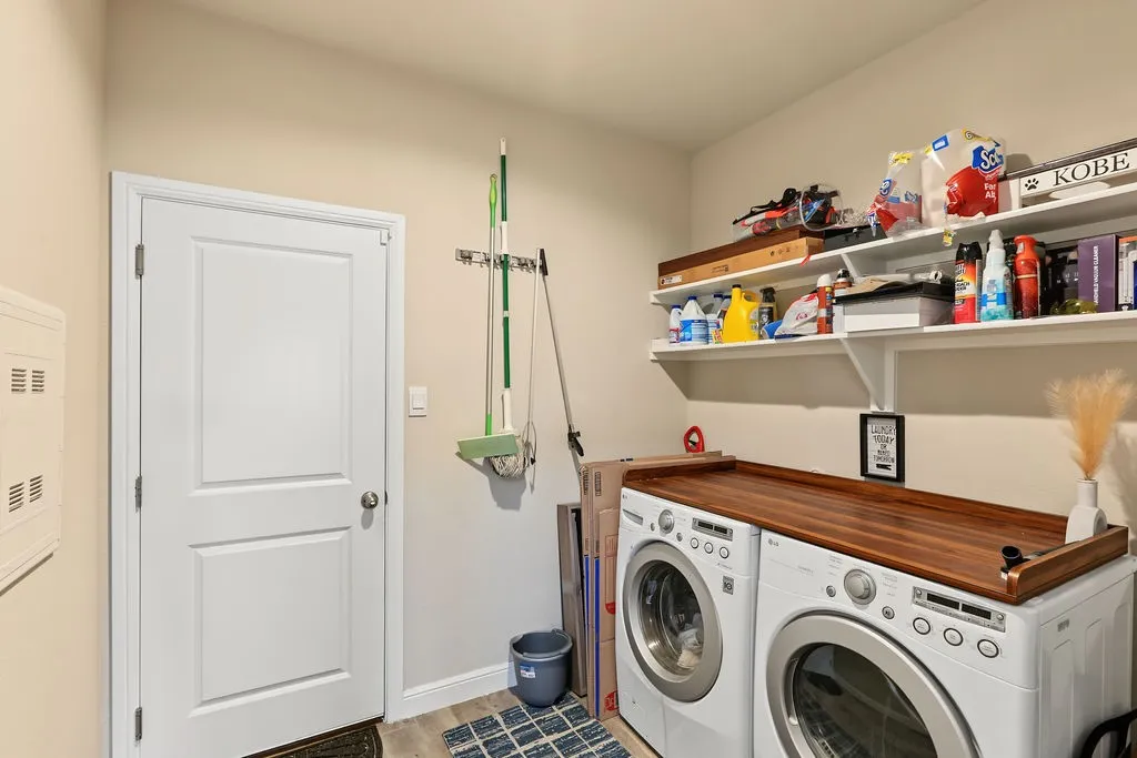 View of laundry room with shelving