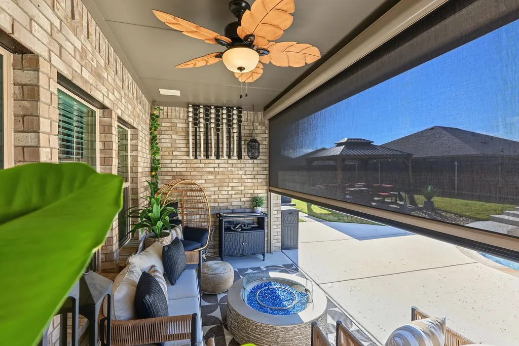 View of back patio with pull down screen