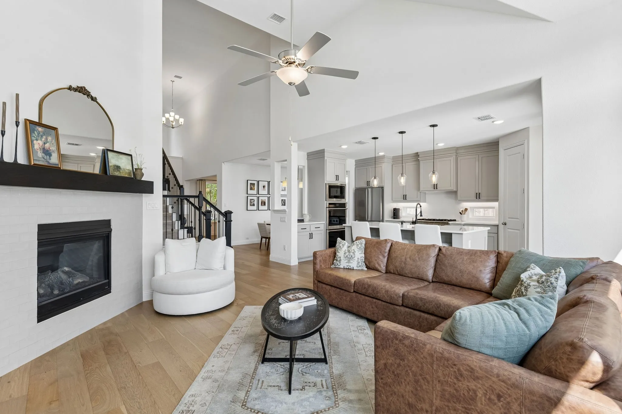 You will love this open floor plan! Notice the height of the ceilings and the inviting flow between the living room and the kitchen.