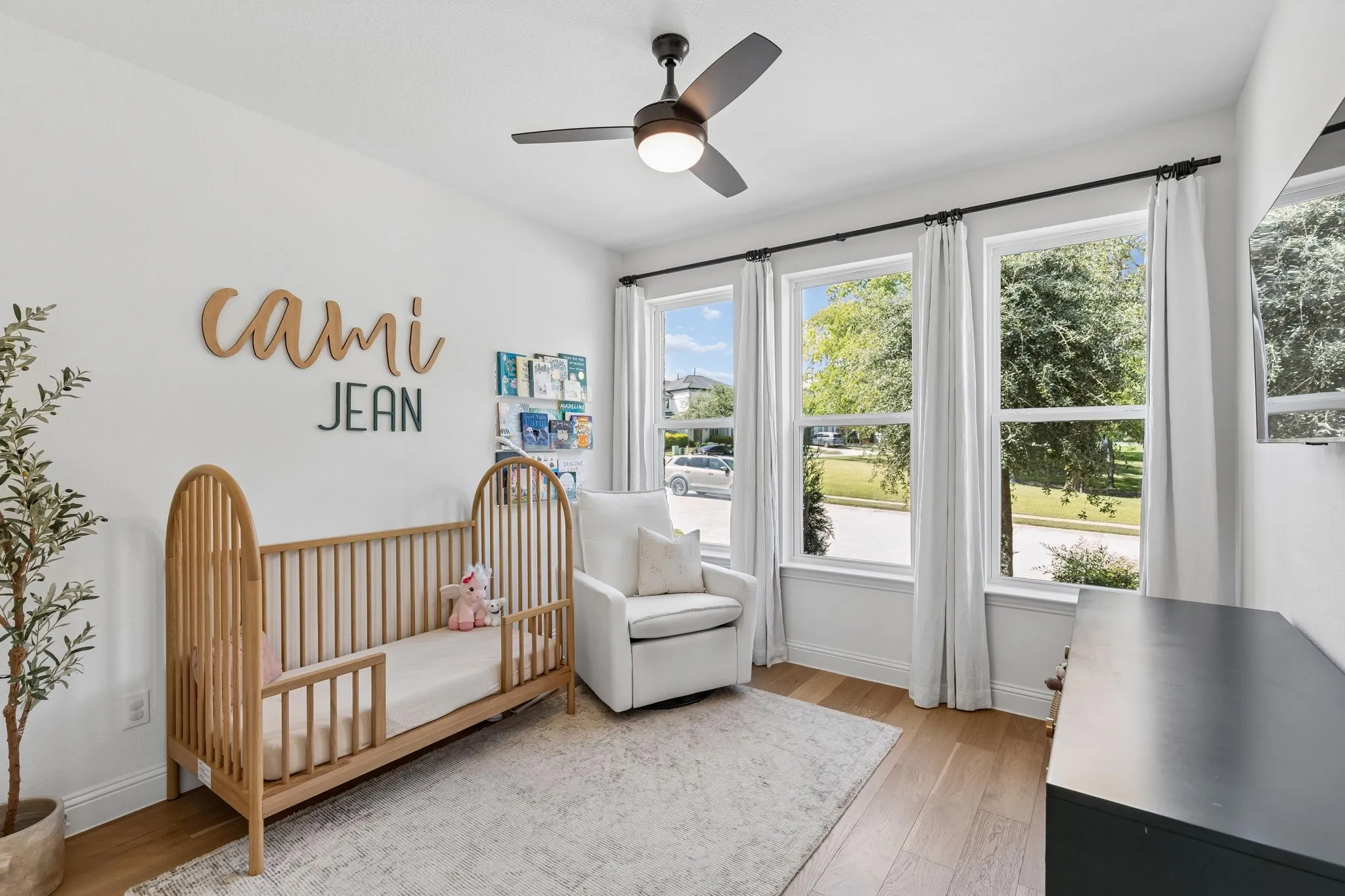 Charming and versatile, this light-filled bedroom offers warm wood flooring, generous natural light, a ceiling fan, and ample wall space for furnishings. This first floor bedroom can easily accommodate a variety of needs and lifestyles.