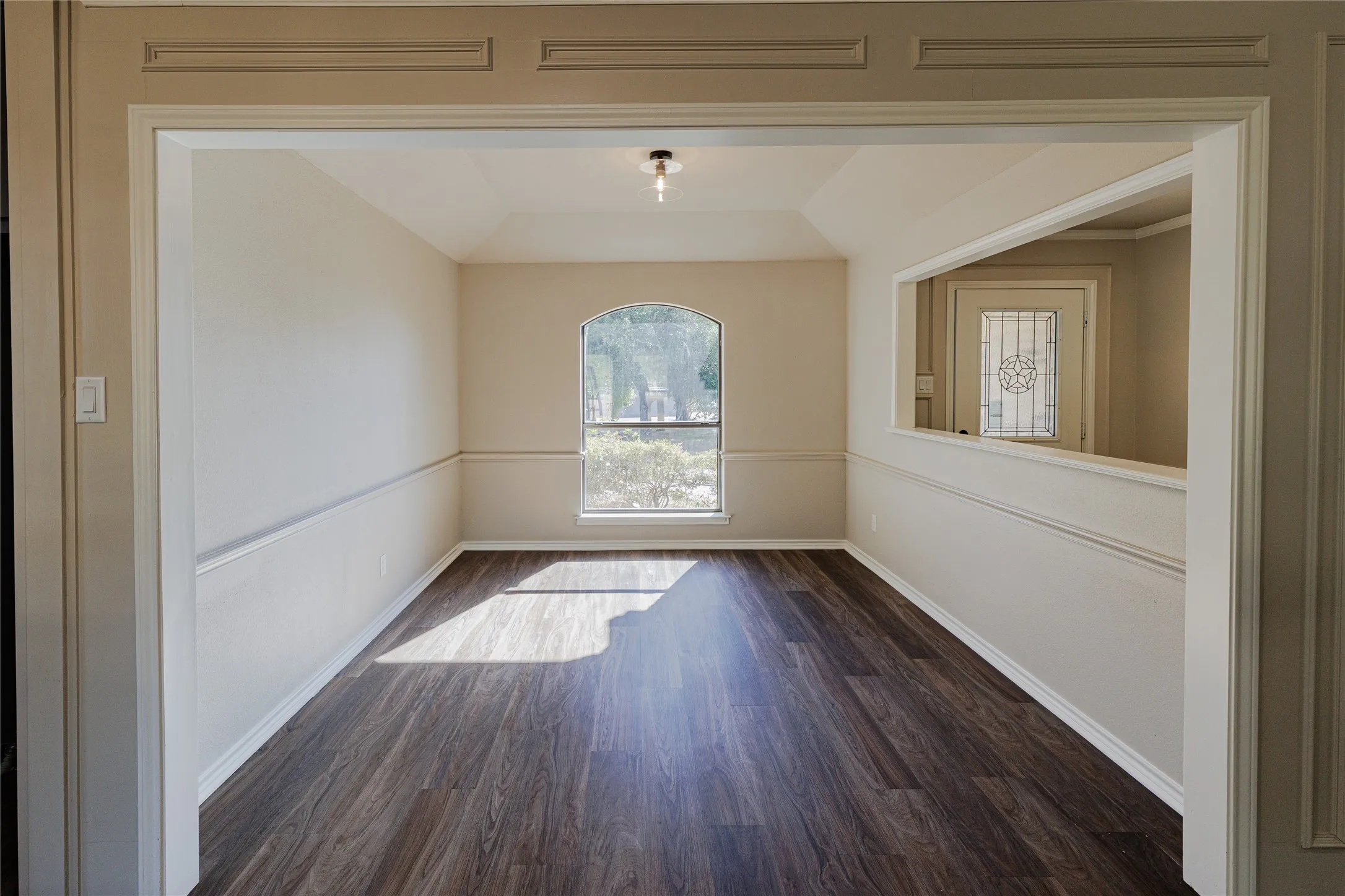 Looking into formal dining standing at the entrance.