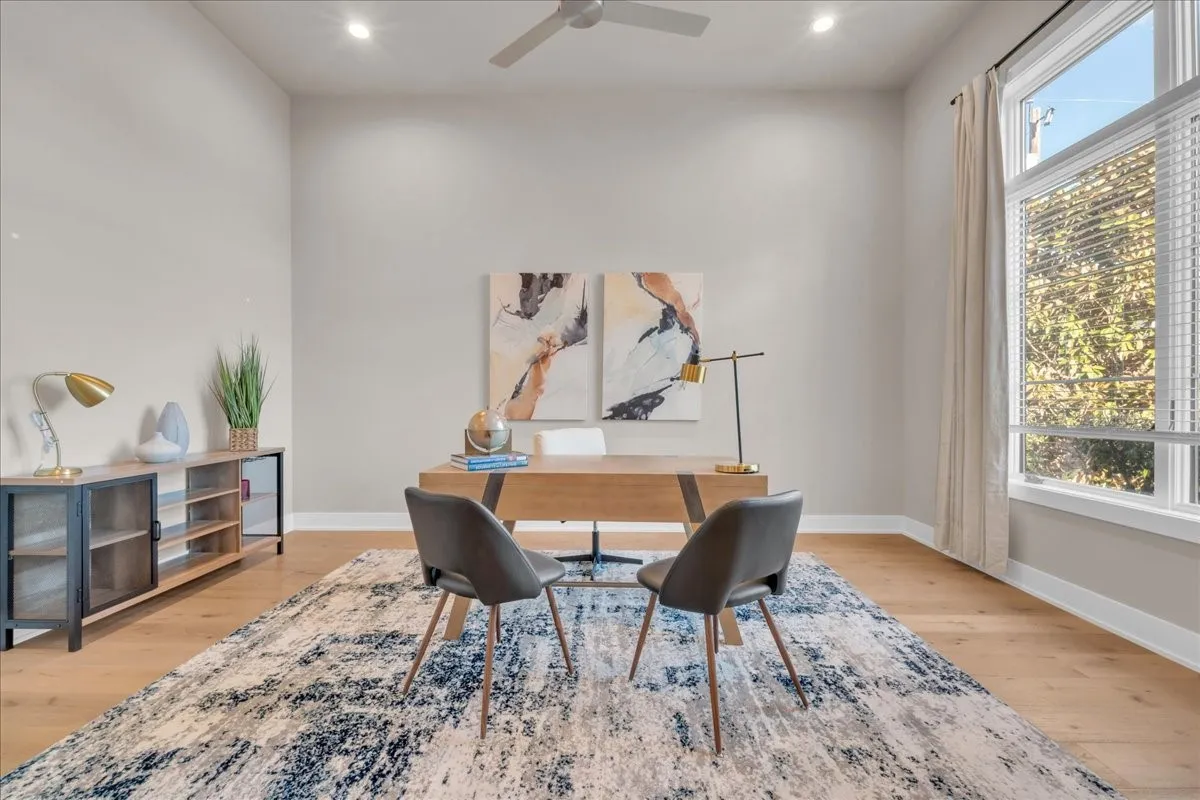 12' High ceilings, recessed lighting, wood-finish flooring, ceiling fan, and large windows with blinds