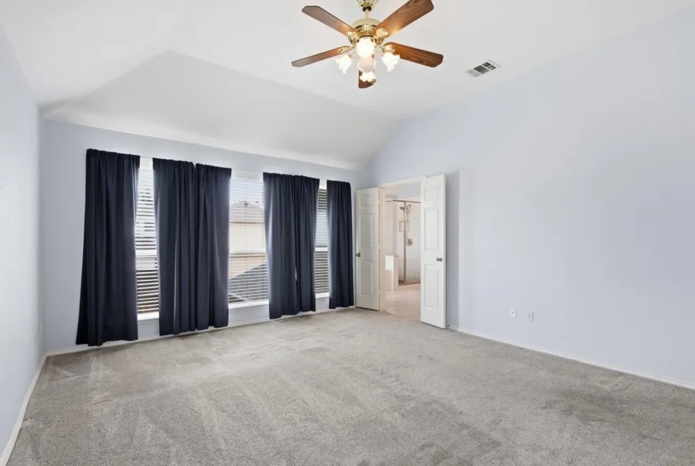 Vaulted ceiling with an attached ceiling fan