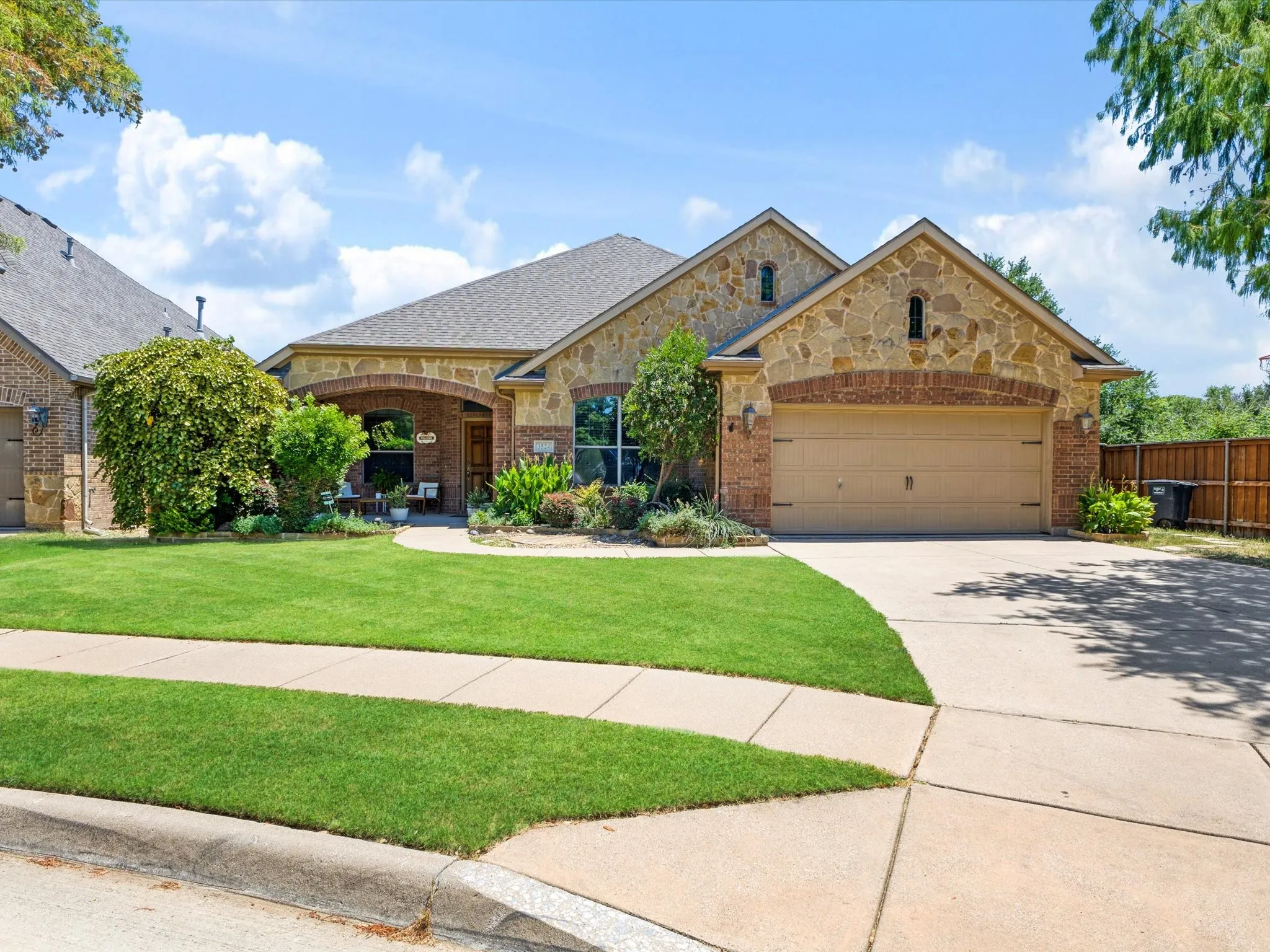 Stone and brick facade with an arched entry