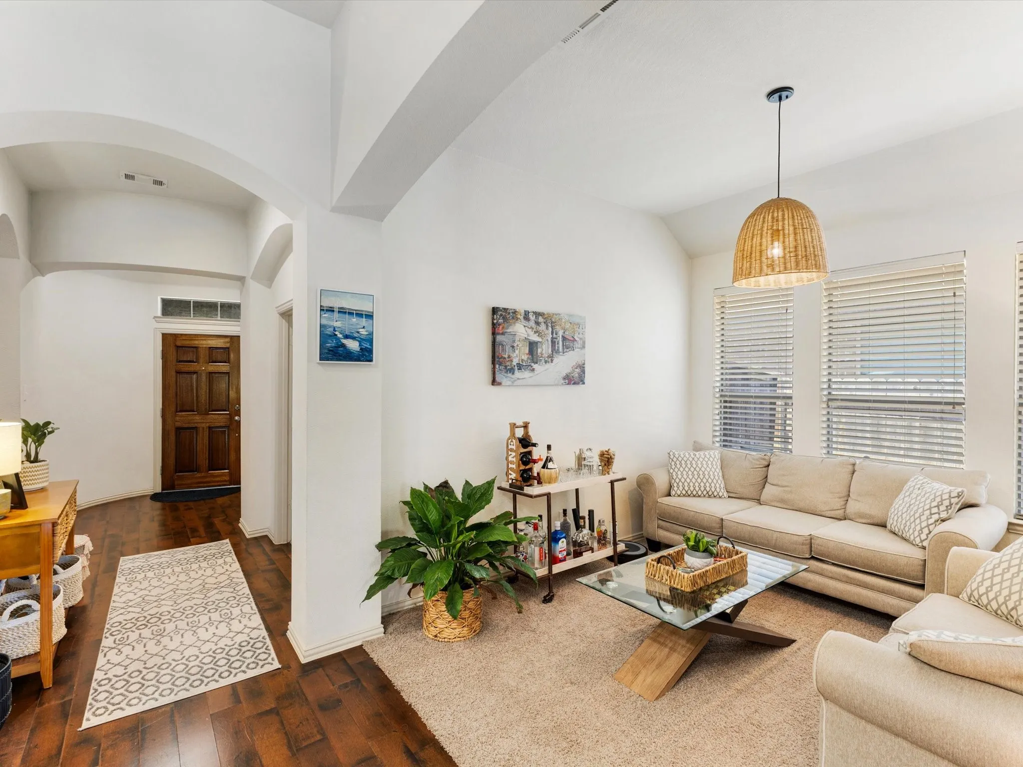 Warm wood-finish flooring complemented by neutral wall tones