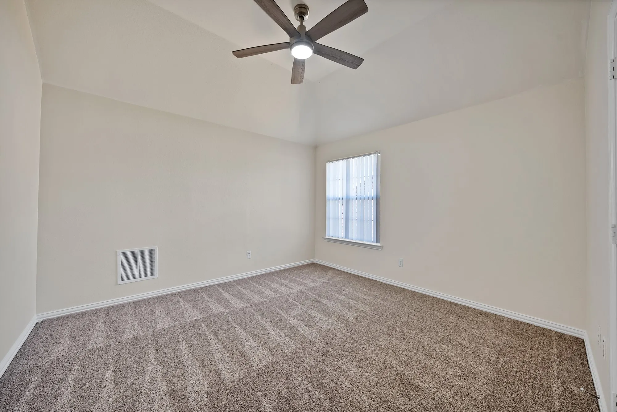 Vaulted ceiling with an attached ceiling fan
