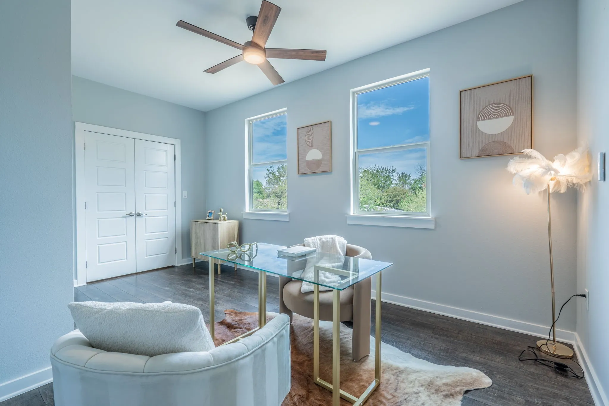 Wood-finish flooring, dual windows, and a ceiling fan