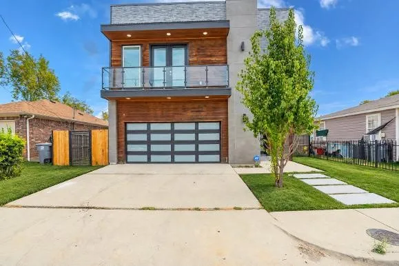 Modern exterior with wood-finish siding and a flat roofline
