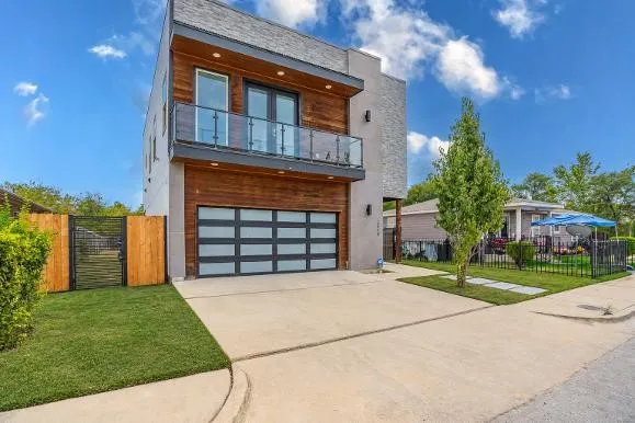 Modern architectural design featuring a wood-clad and stucco facade