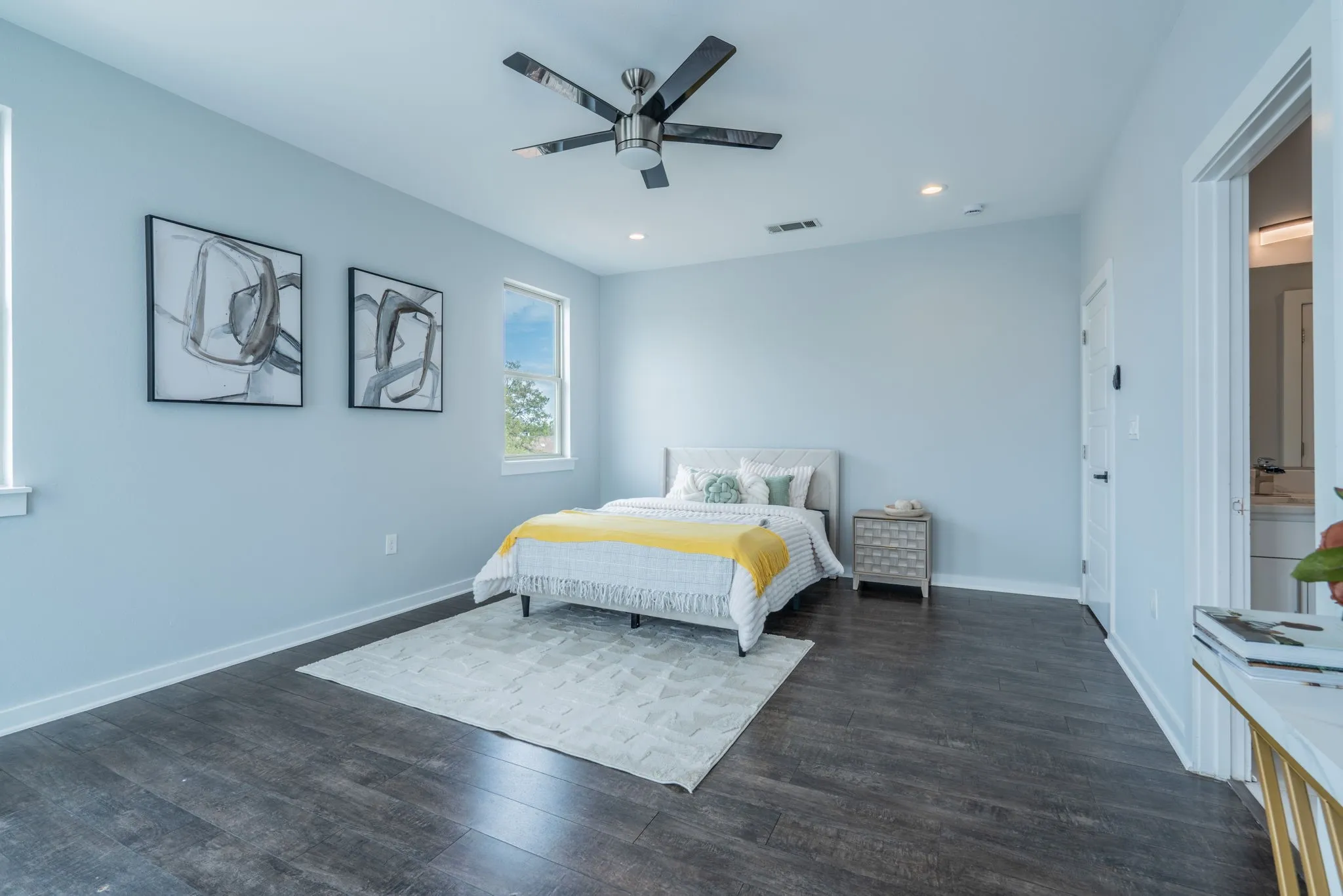 Dark wood-finish flooring complemented by light-colored walls