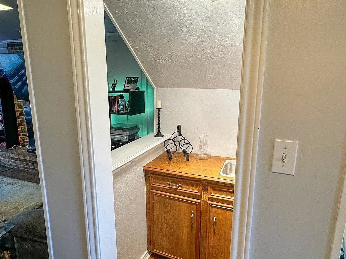 Wood-finish cabinetry with a built-in sink and countertop