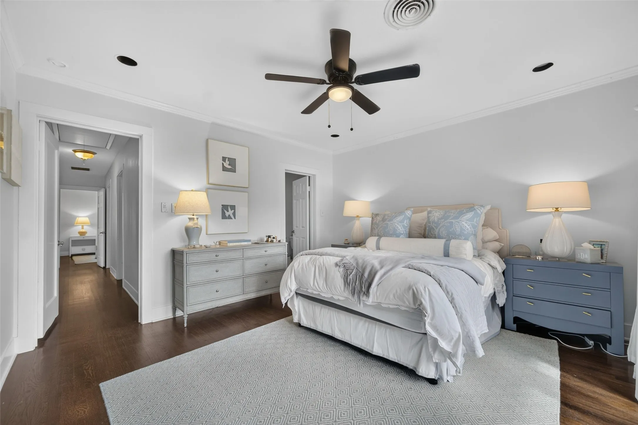 Recessed lighting, crown molding, a ceiling fan, and wood-finish flooring