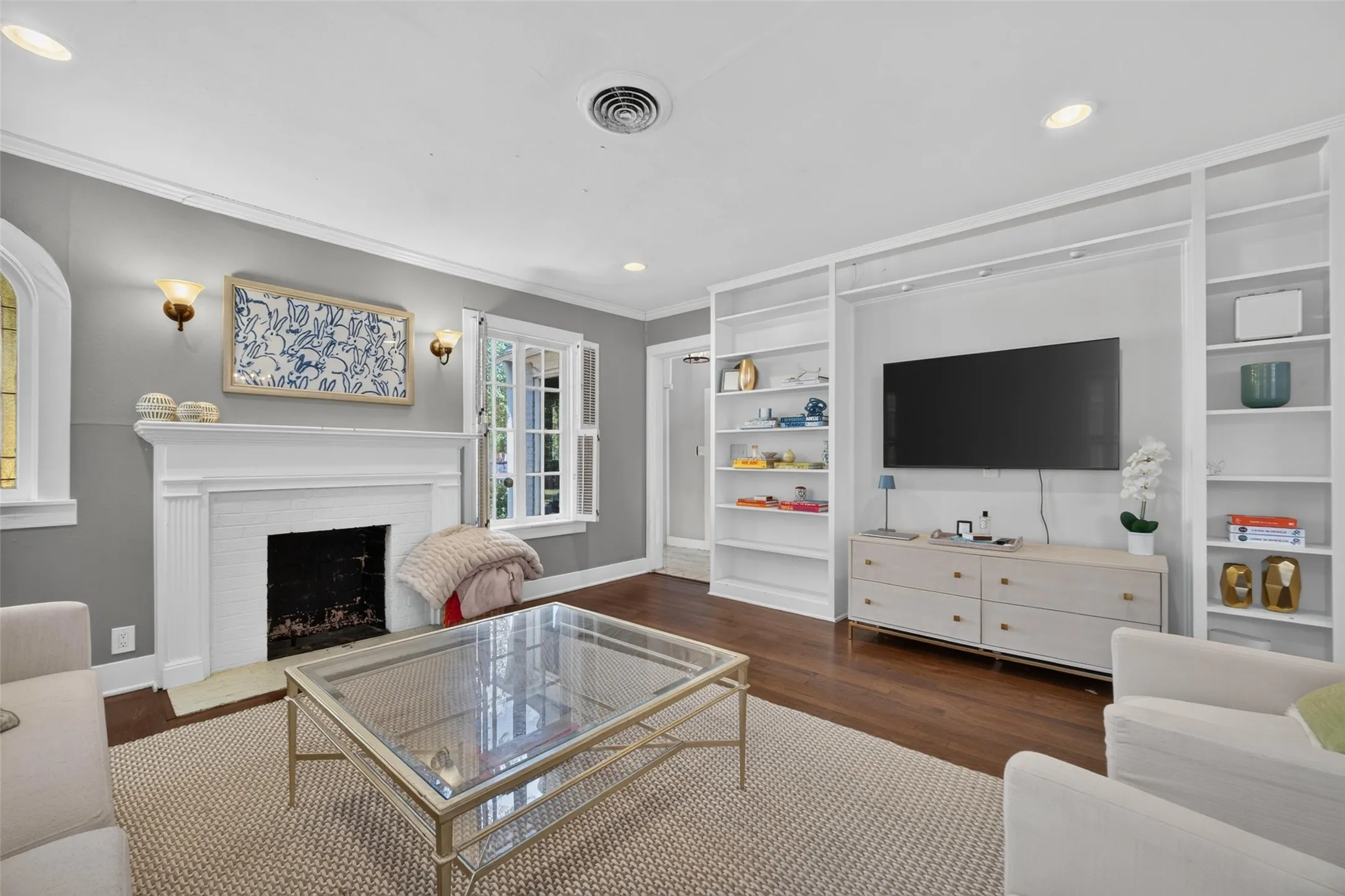 Hardwood-finish flooring complementing a white mantel and fireplace