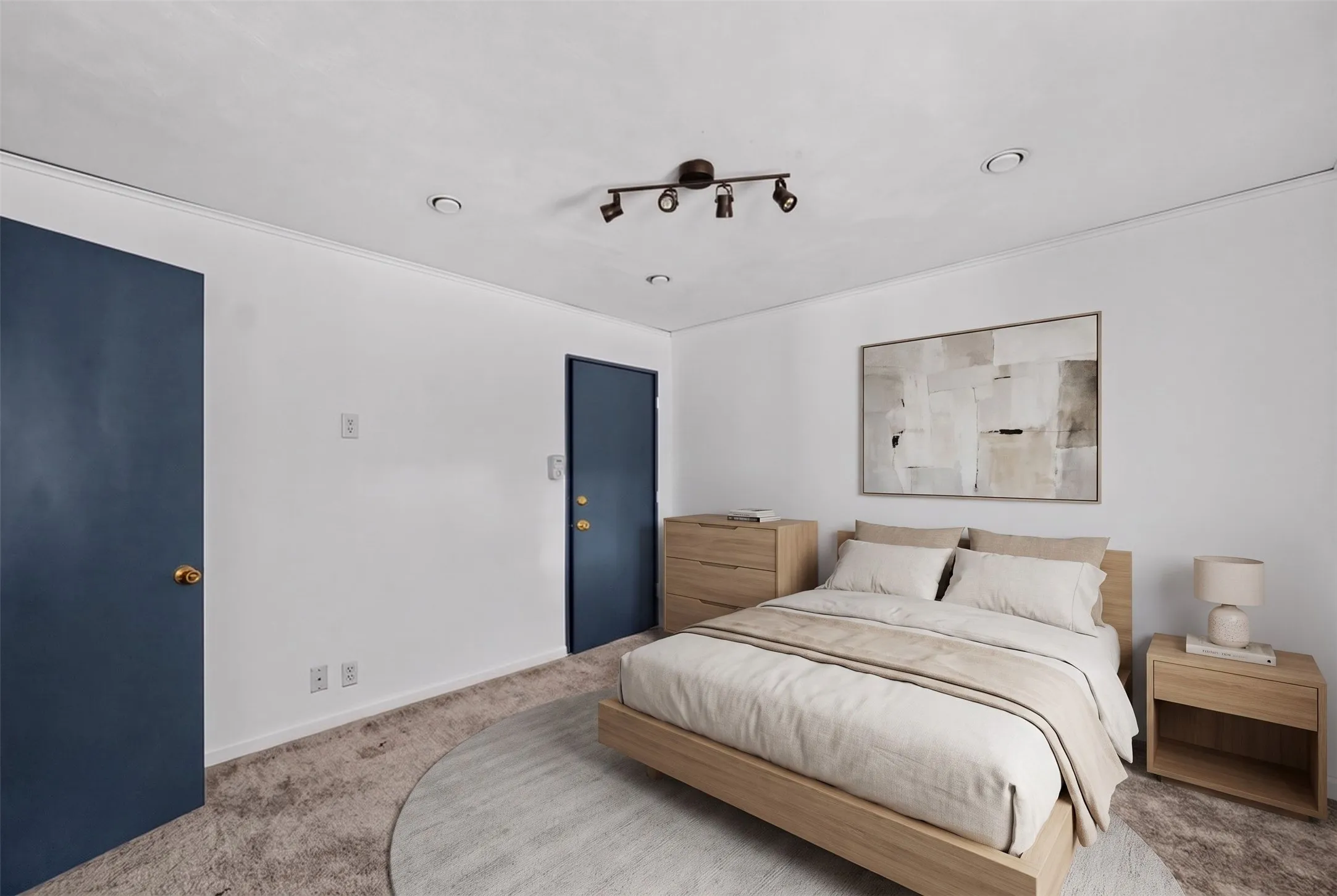 White walls complemented by two blue doors, recessed lighting, and a track light fixture
