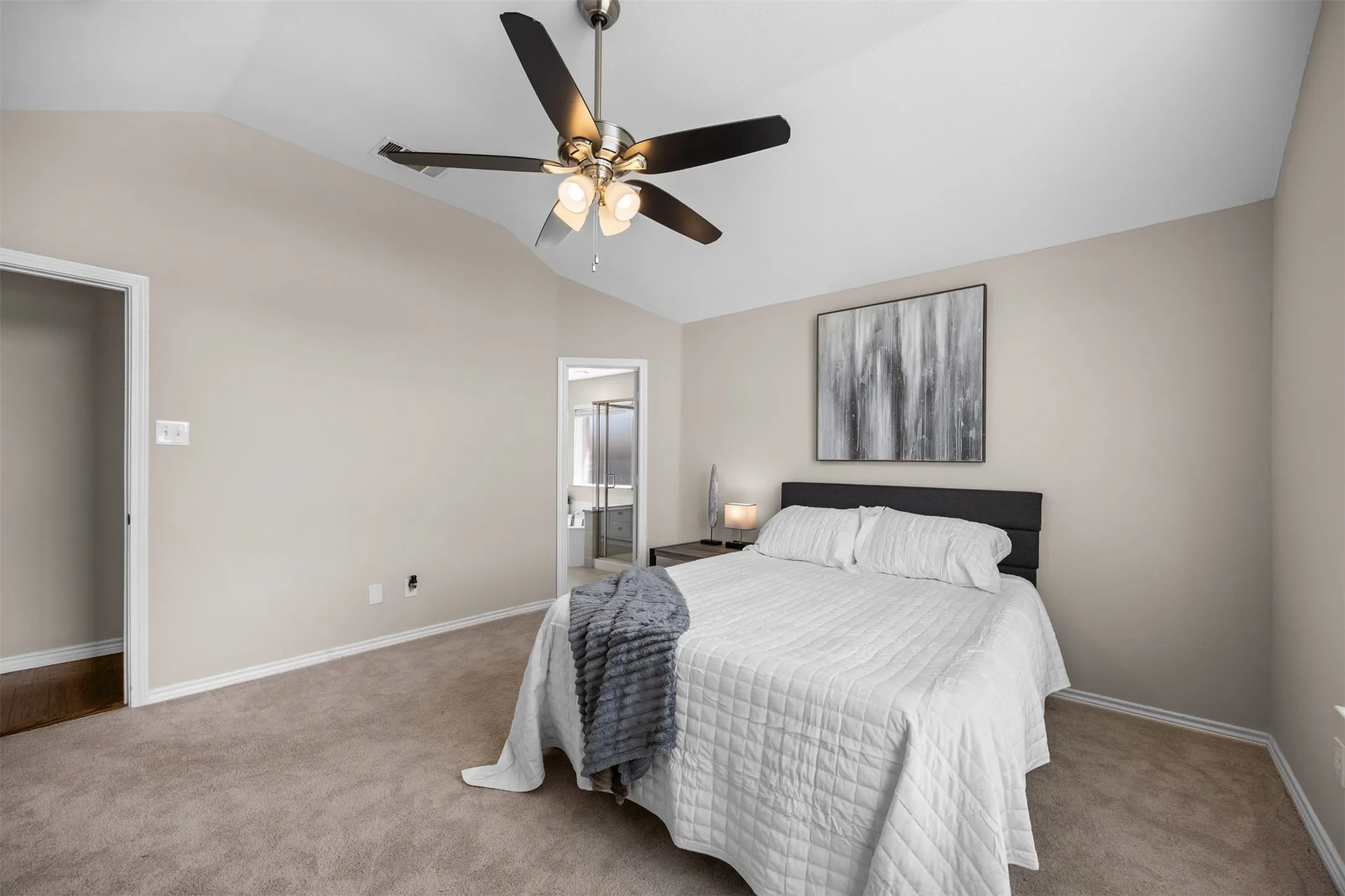 Versatile secondary bedroom with neutral finishes.