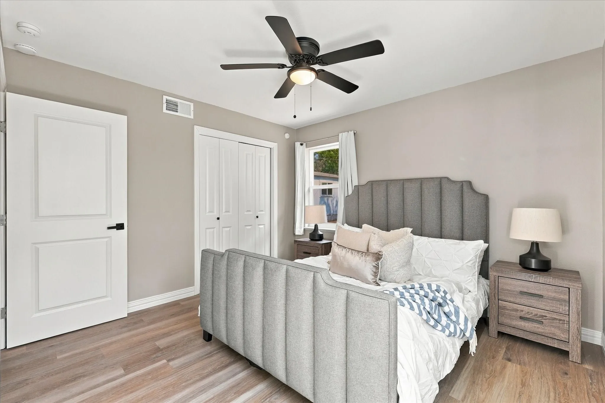 Primary bedroom featuring ceiling fan and NO carpet!