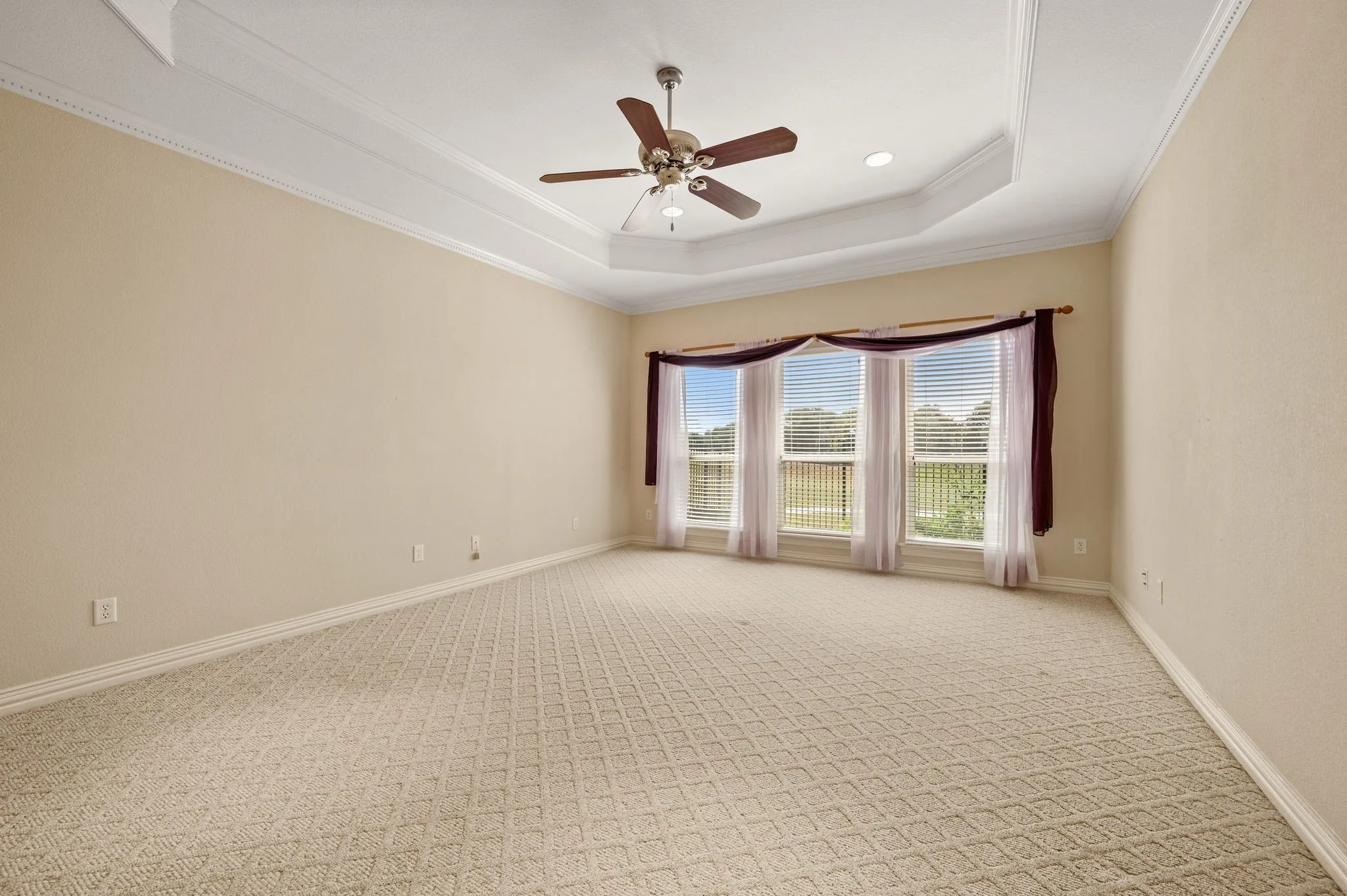 Primary bedroom with view of golf course