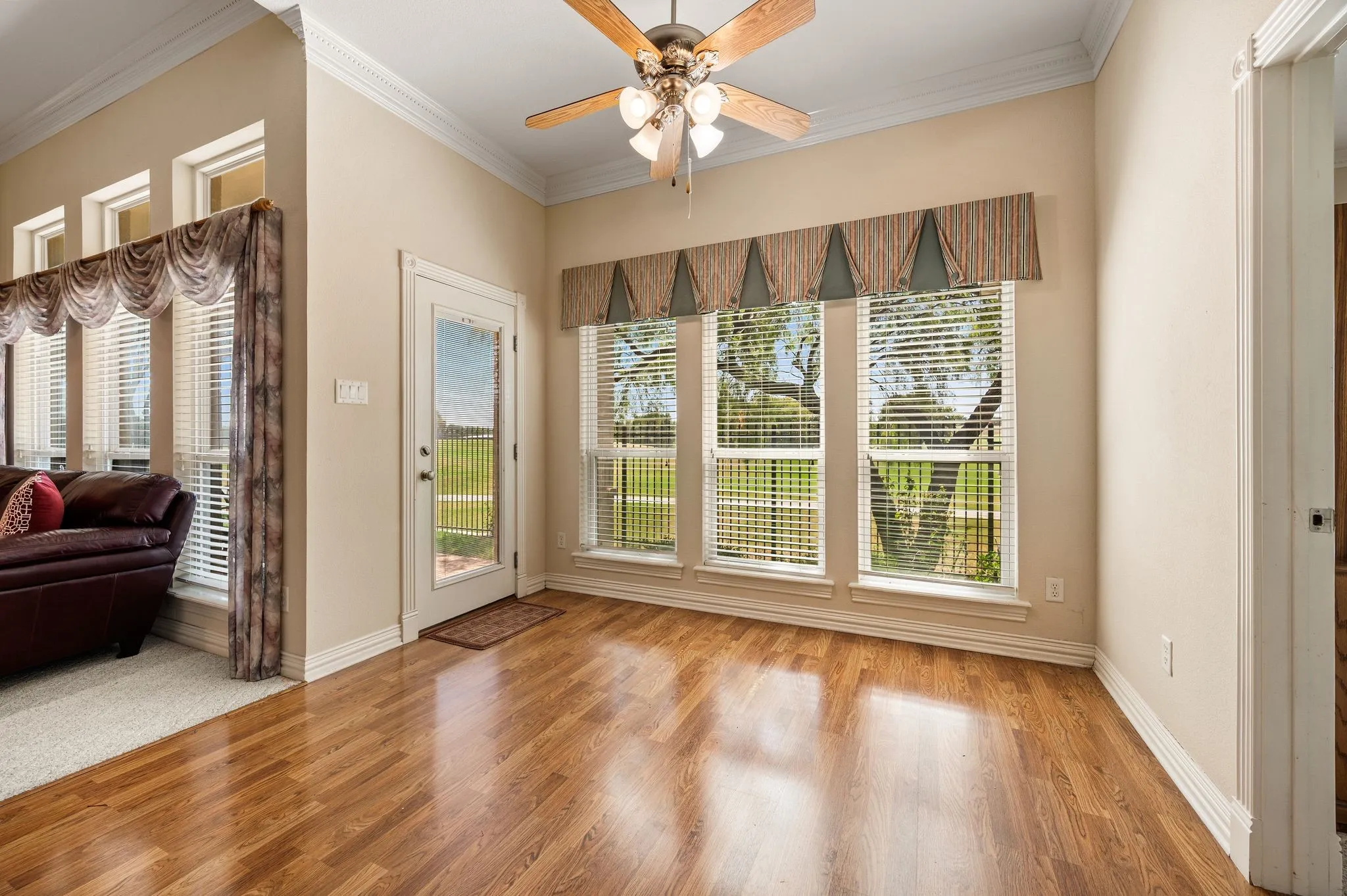 Light and airy breakfast nook opens up to golf course