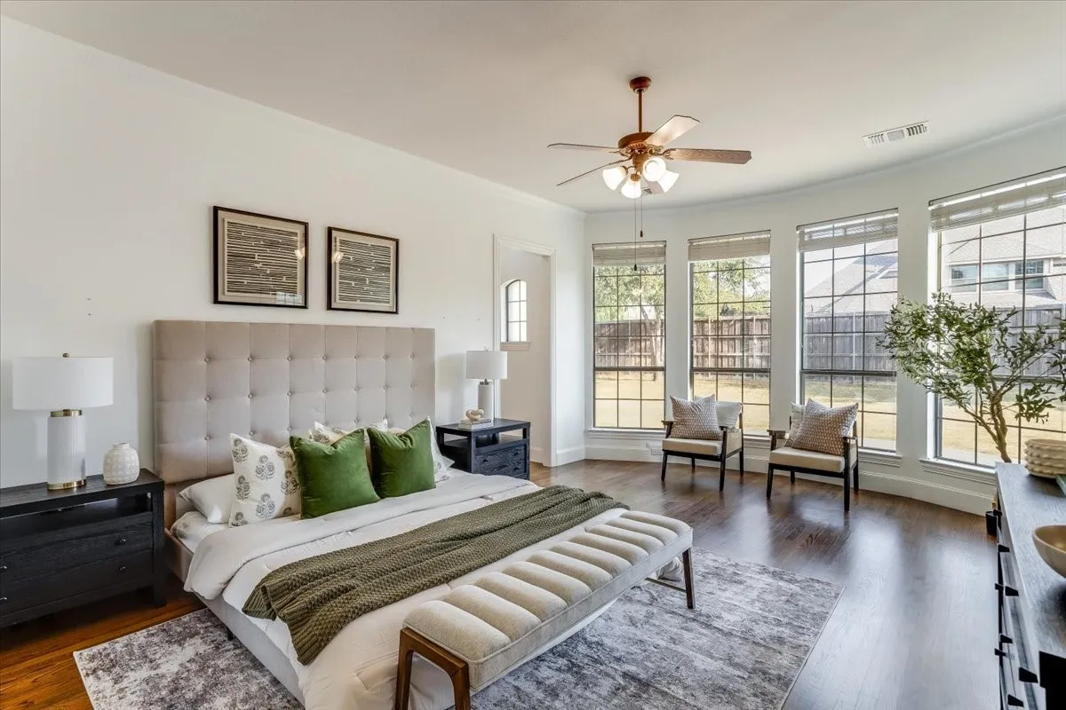 Recessed ceiling fan, wood-finish flooring, and multiple bay windows with blinds