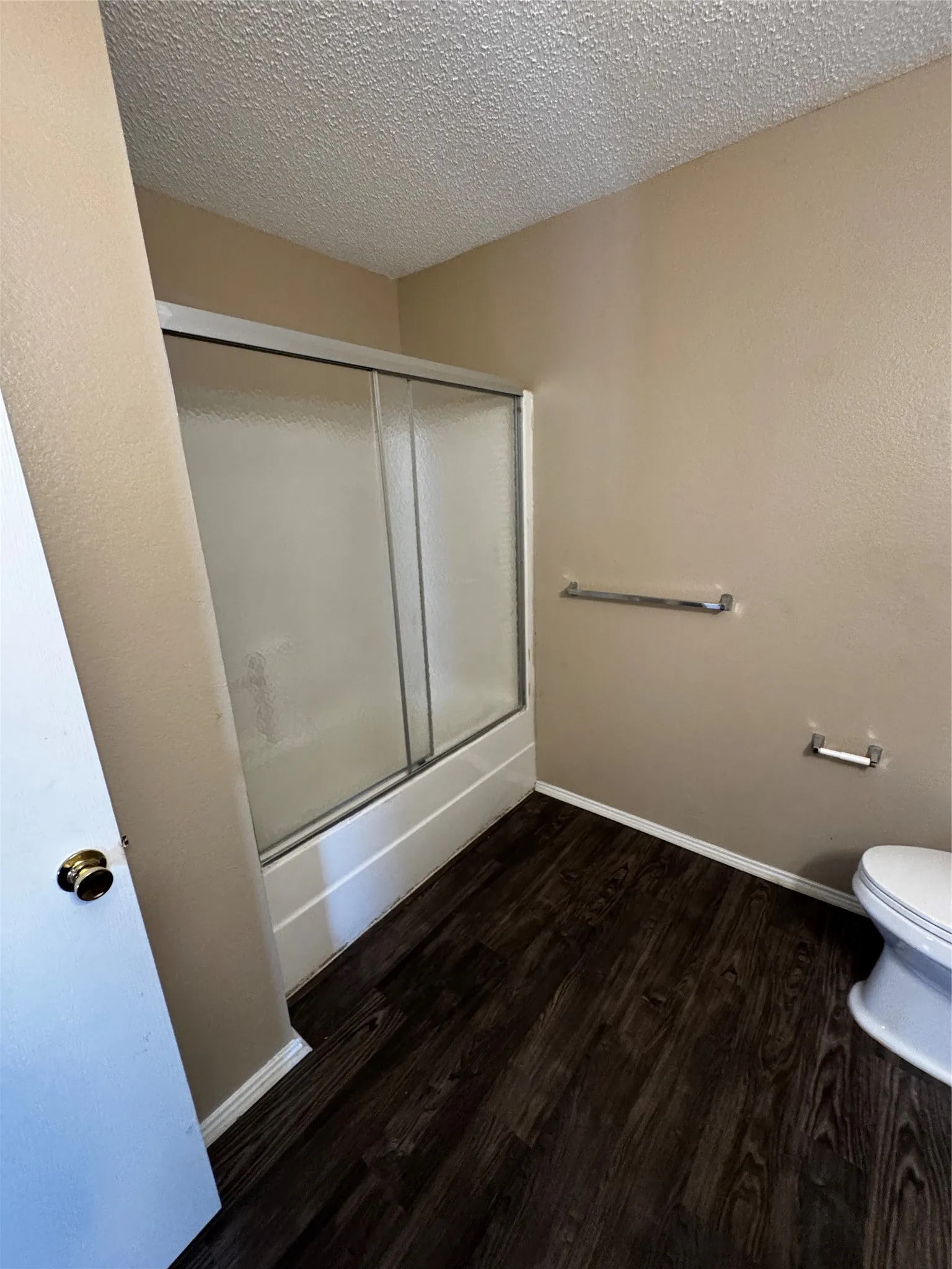 Tub and shower combination with sliding glass doors